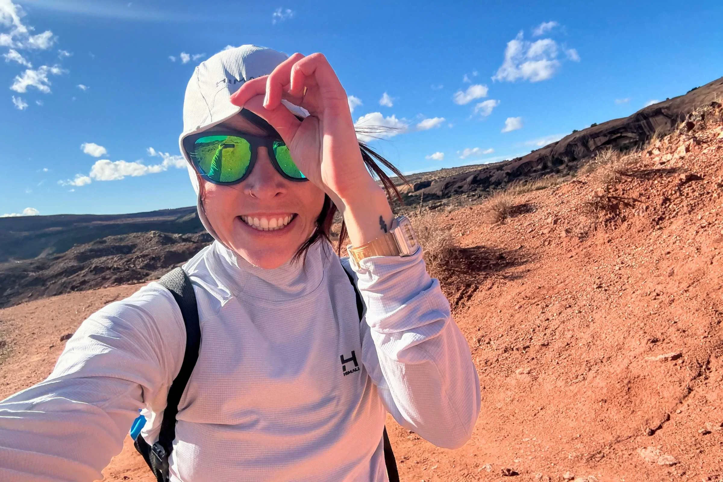   Selfie of woman in a sun hoody wearing Knockaround Premiums Sport Polarized Sunglasses in the desert  