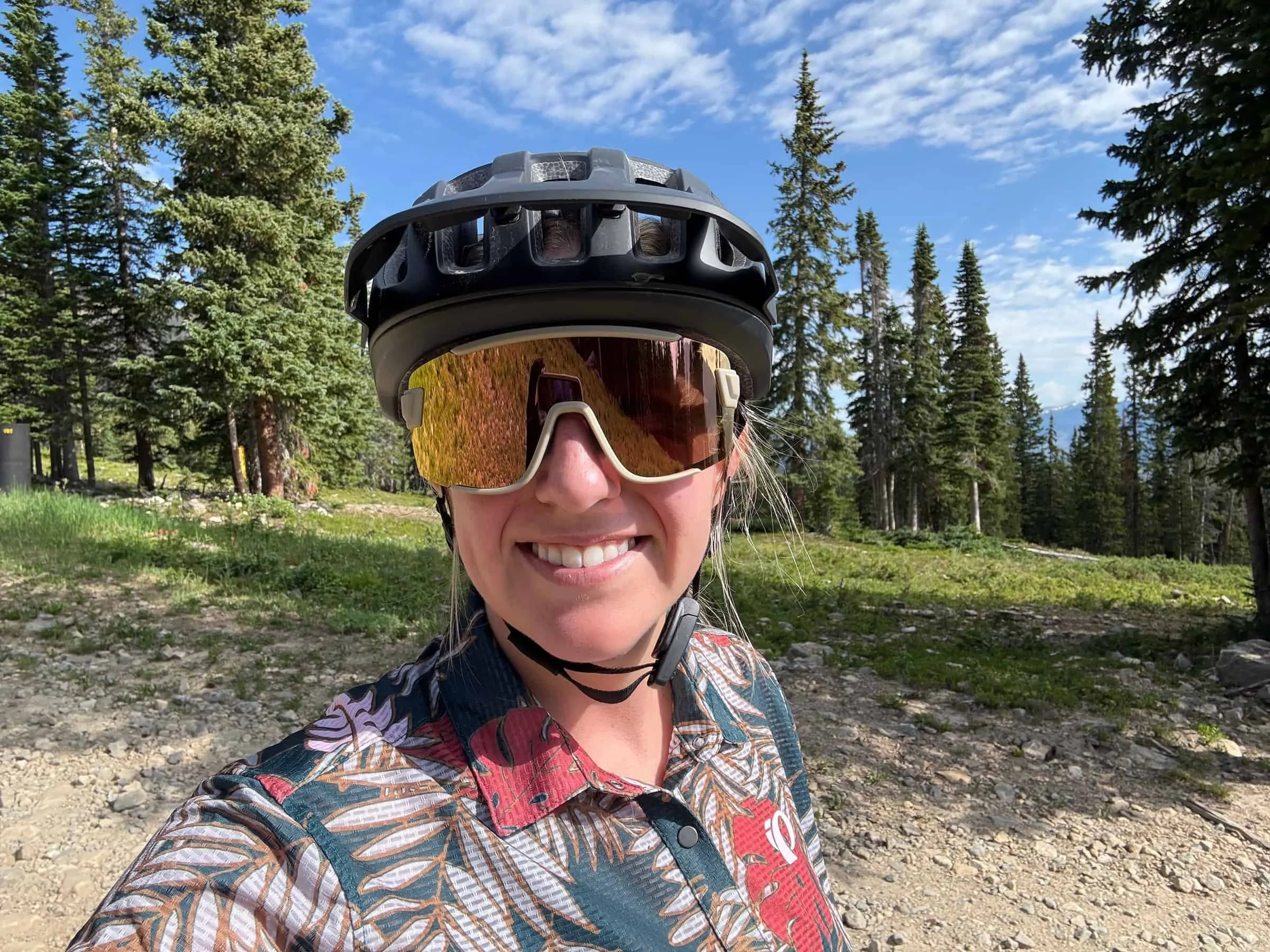   Female mountain biker wearing the Smith Wildcat sunglasses  
