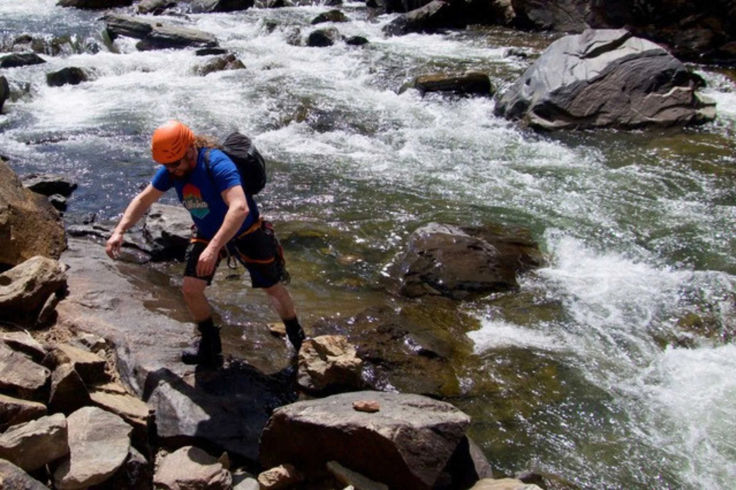   The author testing the Salomon Quest 4 Gore-Tex waterproofing as he fords a river.   Photo courtesy Chris Meehan.  