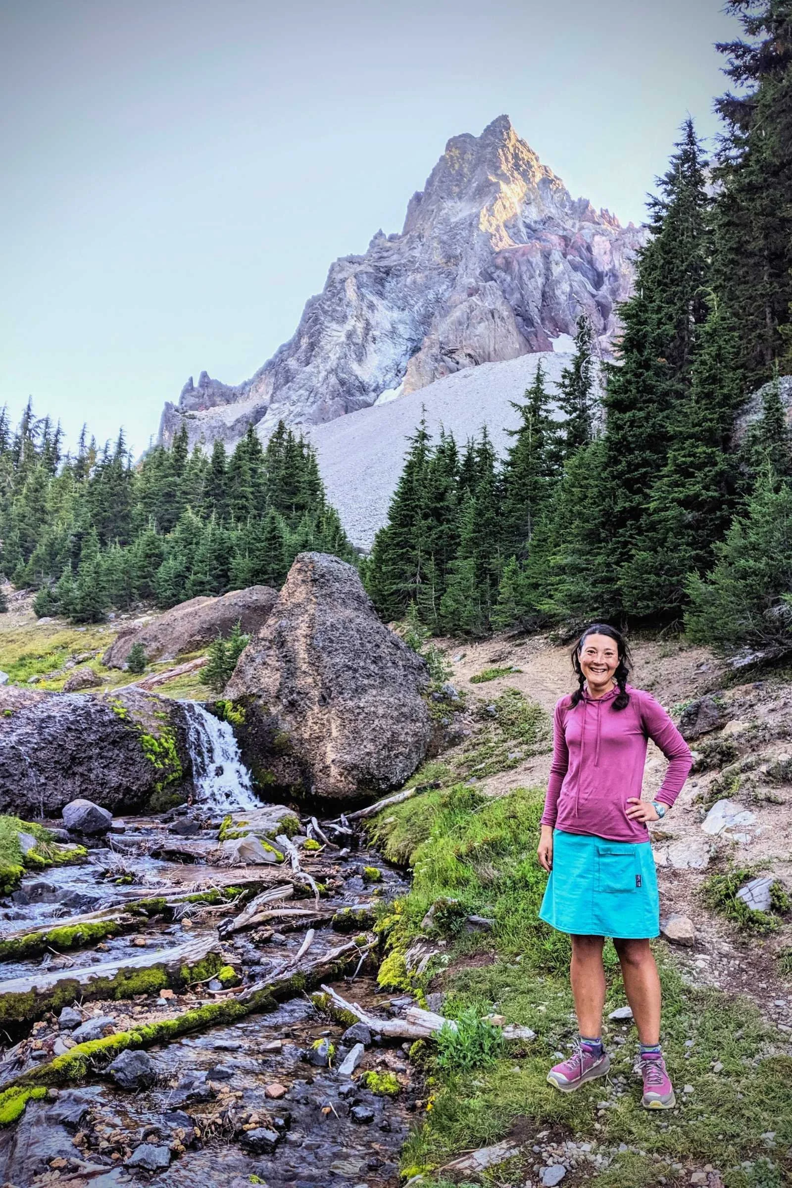   Author Liz Thomas testing the Ridge Merino Solstice Sun Hoodie on a 1000 mile southbound section hike of the Pacific Crest Trail with Mt. Thielsen in the background.   Photo courtesy Liz Thomas.  