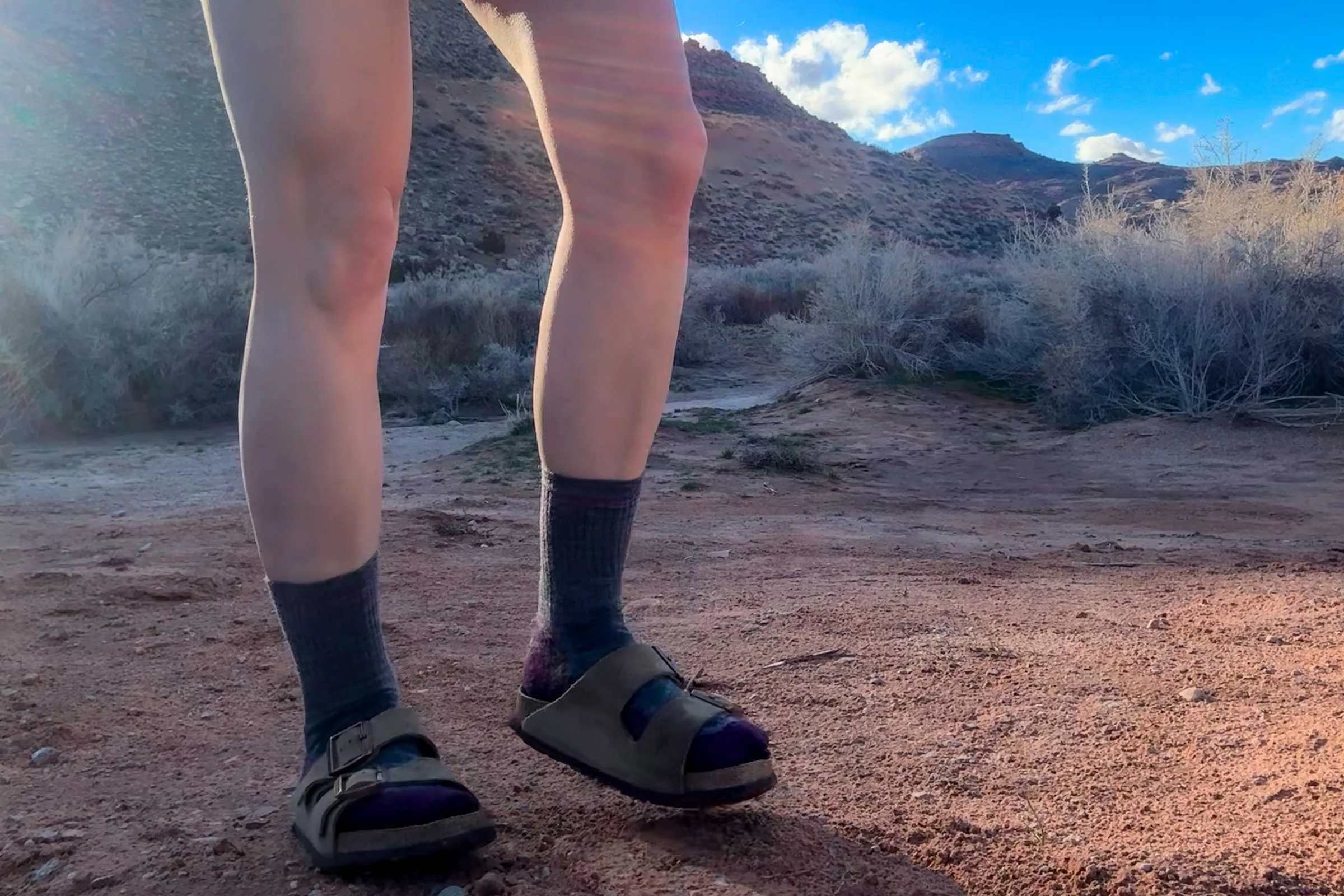   Person wearing Birkenstock Arizona Soft Footbed sandals on desert trail  