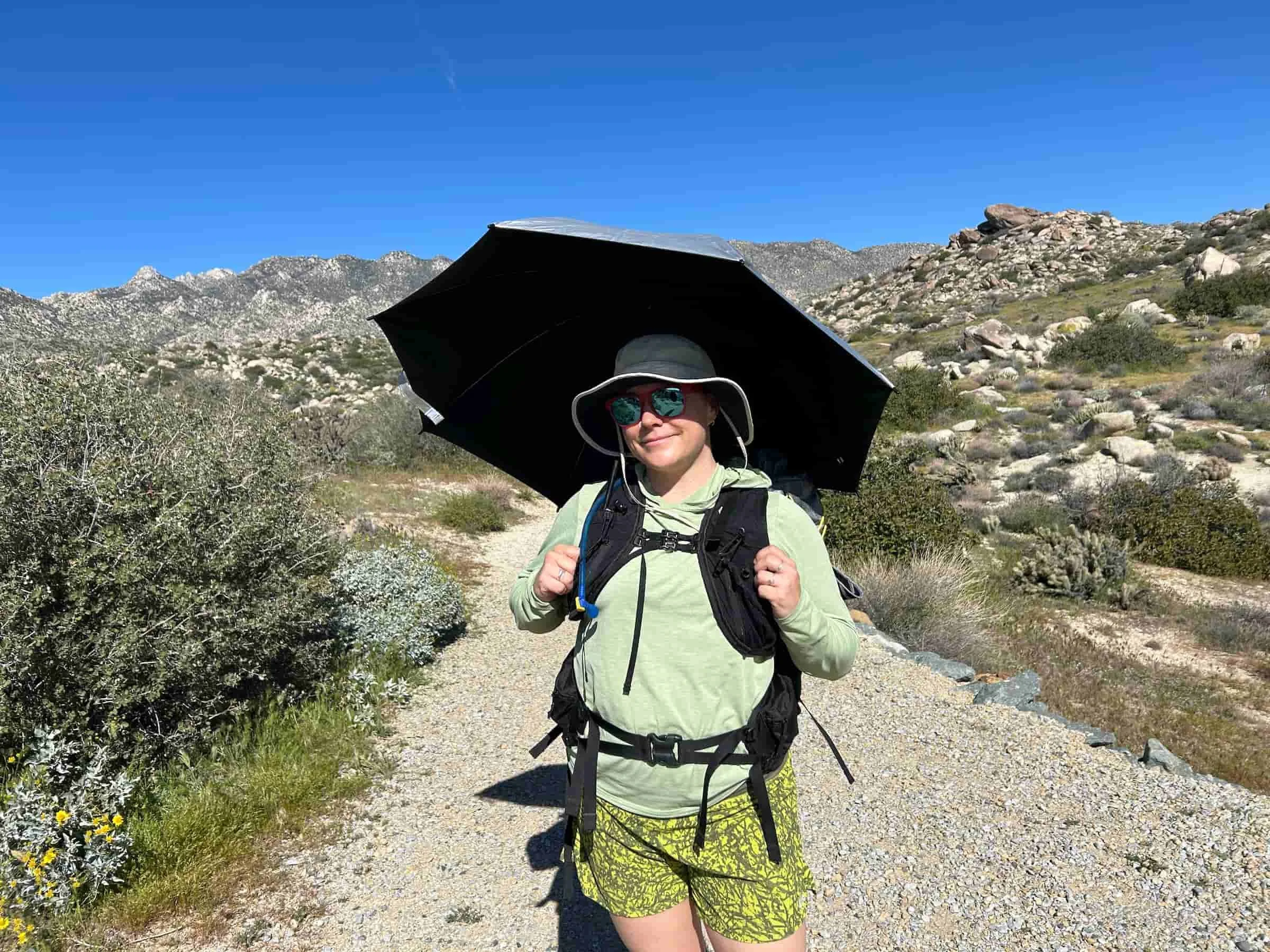   REI Sahara sun hoodie on Treeline Review writer Katie Hawkes on a hike in Anza Borrego Desert.   