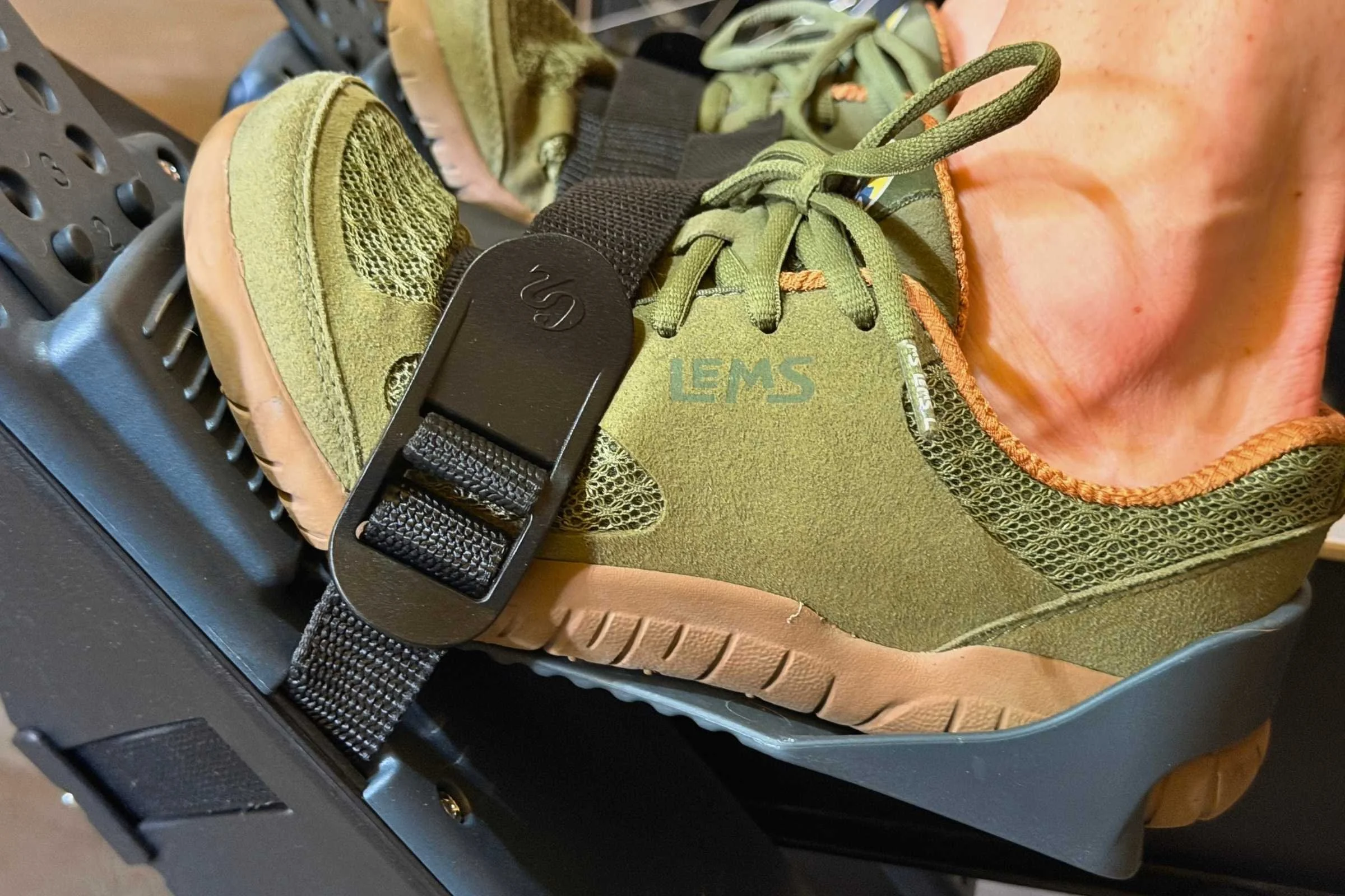   Lems Primal 3 barefoot shoe secured in rowing machine foot strap  
