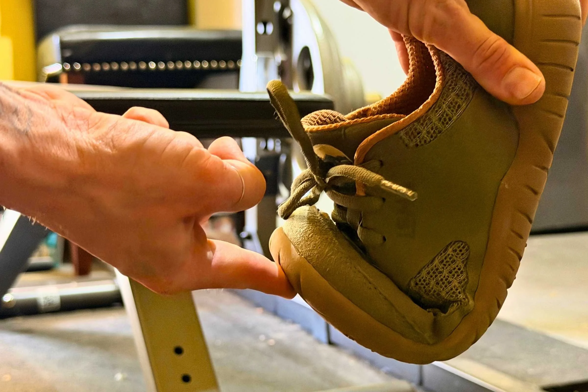   Flexible Lems Primal 3 barefoot shoe bent to show sole flexibility  