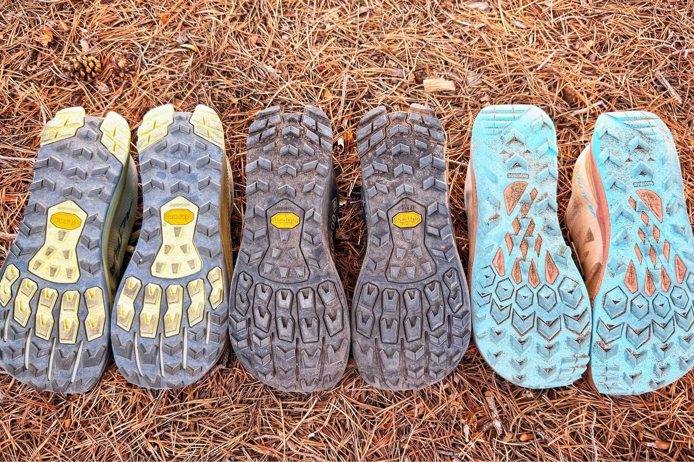   From left to right: mOutsoles of Altra Lone Peak 9 and Altra Lone Peak 9+ and Altra Lone Peak 7 trail running shoes (with over 400 miles of wear) shown side by side for comparison  