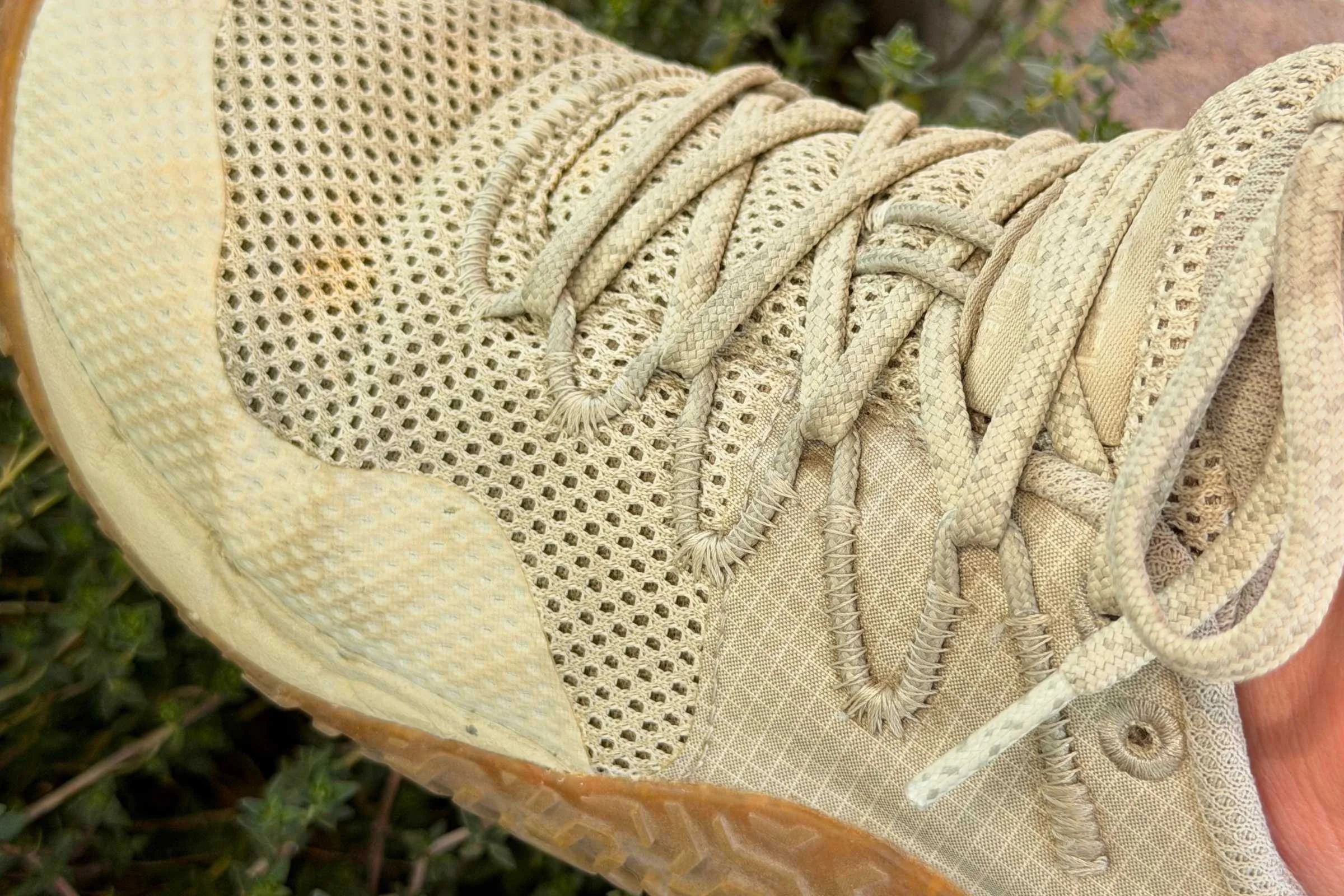   Close-up of Merrell Trail Glove 7 barefoot shoe showing mesh upper and lacing system  