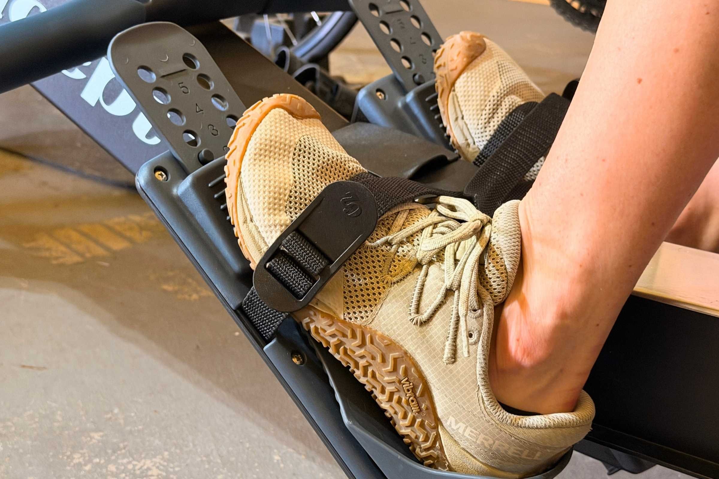   Merrell Trail Glove 7 barefoot shoes secured in rowing machine foot straps  
