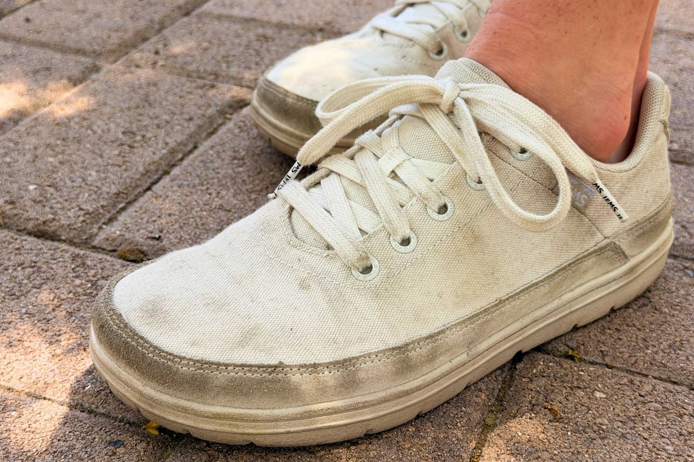   Close-up of Lems Chillum barefoot shoes on stone pavers  