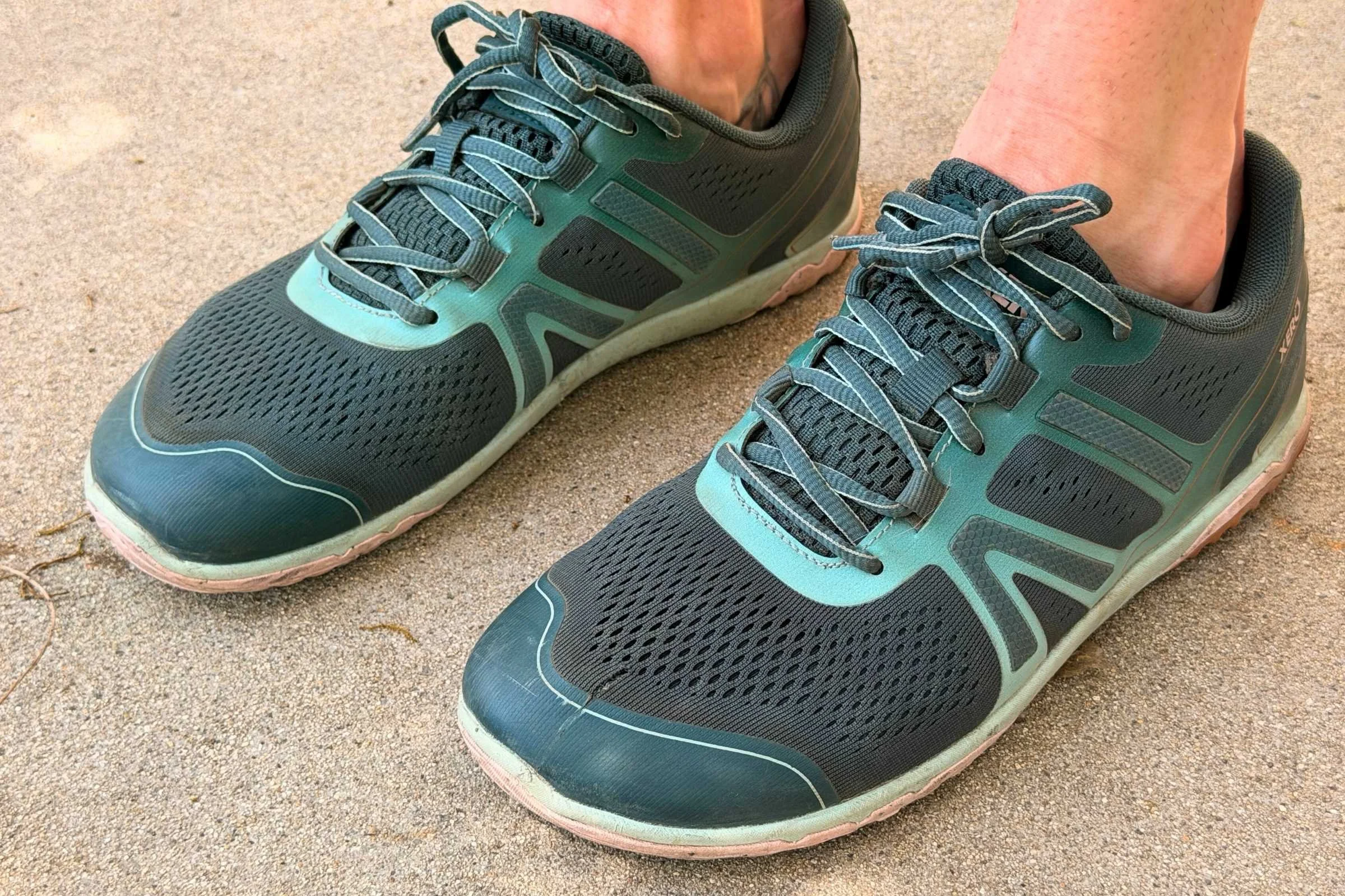   Pair of Xero Shoes HFS II barefoot running shoes on pavement  