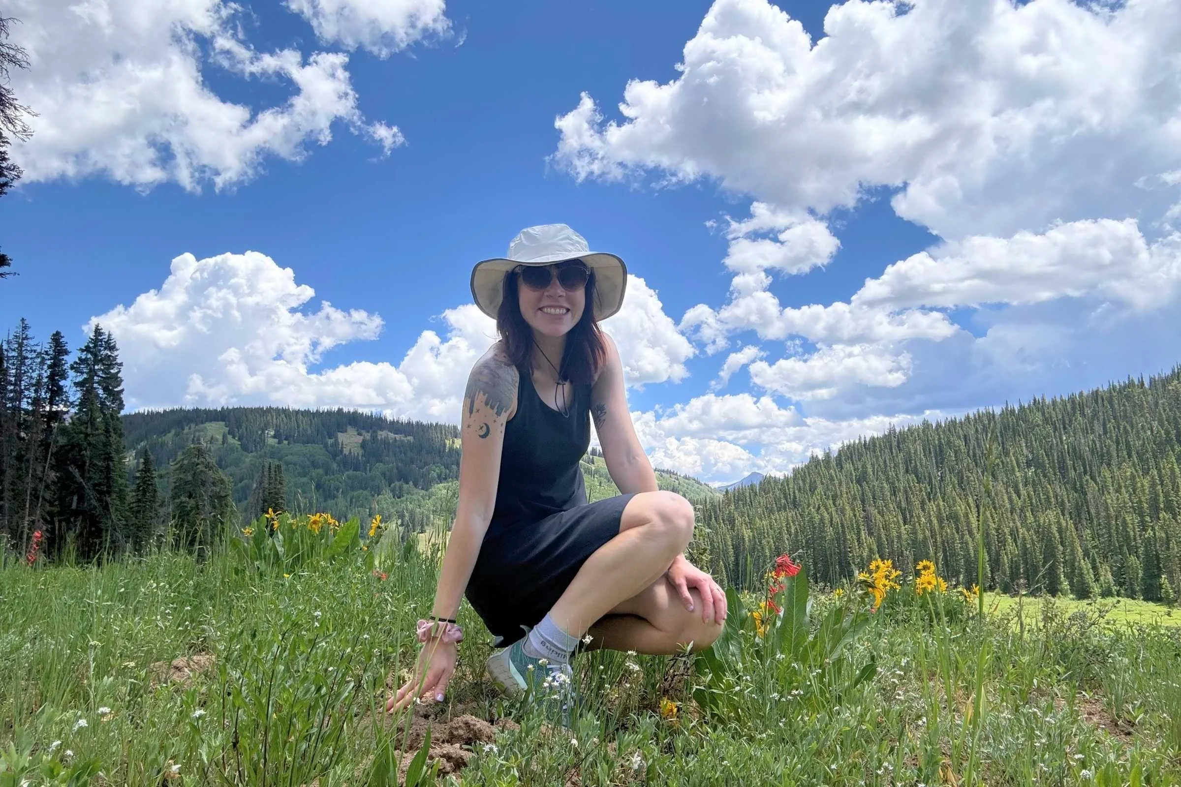   Modeling the Robbins Spotless Evolution Tank Dress in a wildflower field  