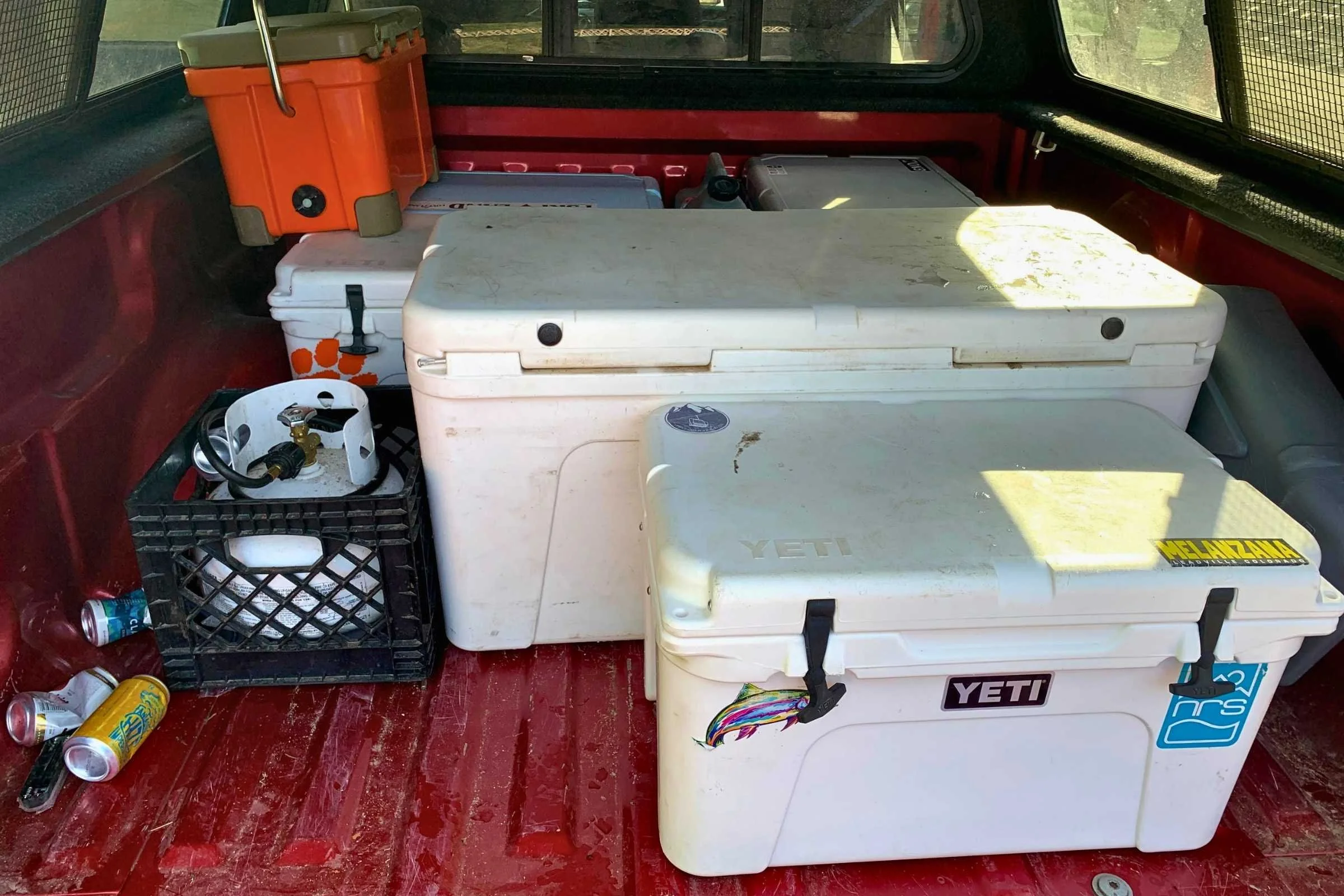   Several coolers of different sizes in the back of the truck. The Yeti in front is a 35 and the one directly behind it is a 125.   Photo courtesy Josette Deschambeault.  