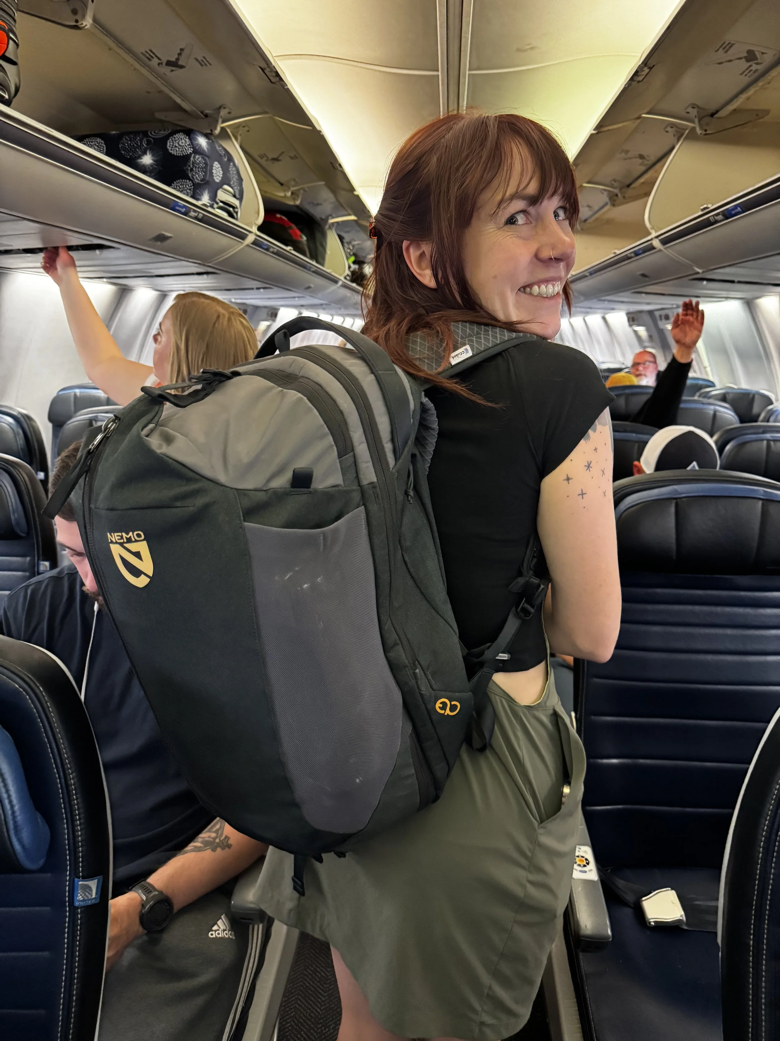   Traveling on a plane where a pack in the Cotopaxi Tolima Overall Dress  