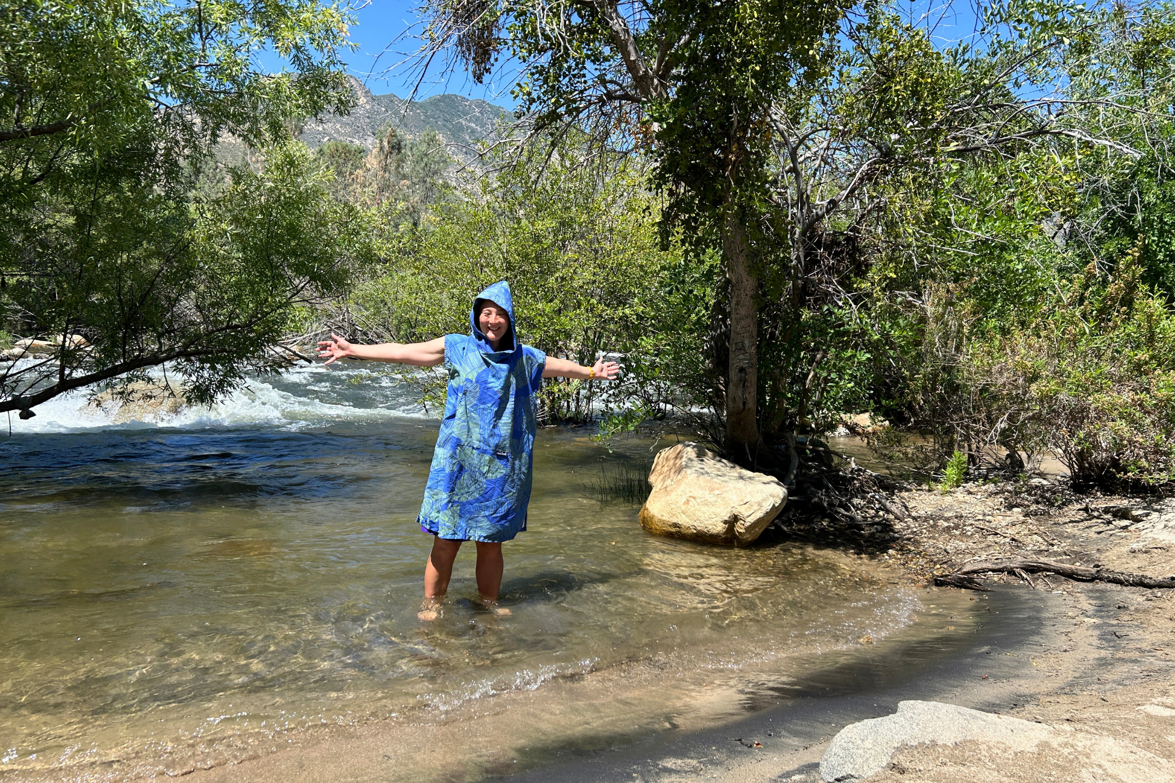   Treeline Review editor Liz Thomas testing the Packtowl Poncho at a local river  