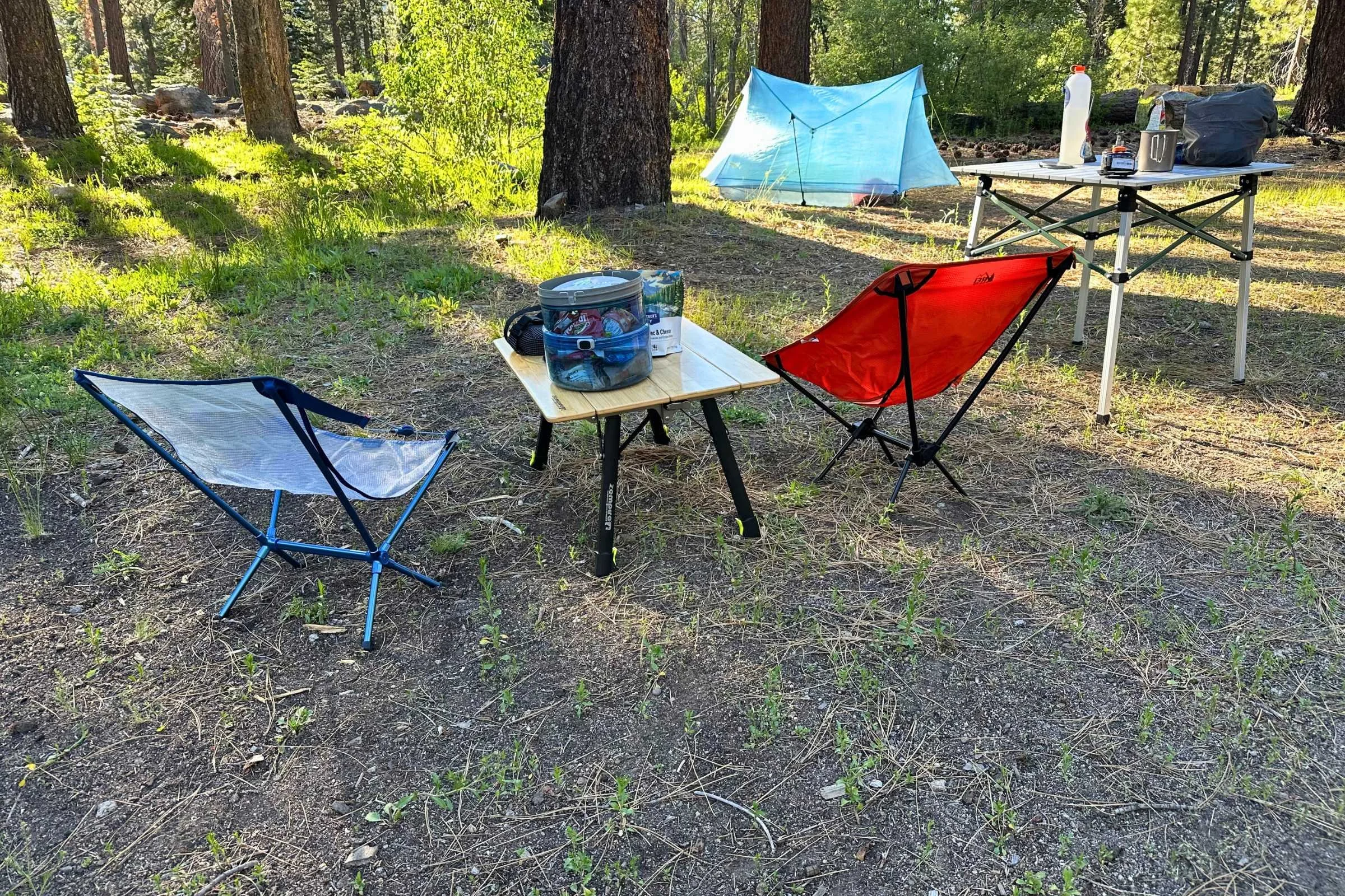   The Zempire Kitpac Pro camping table lowered down to camp chair height.  