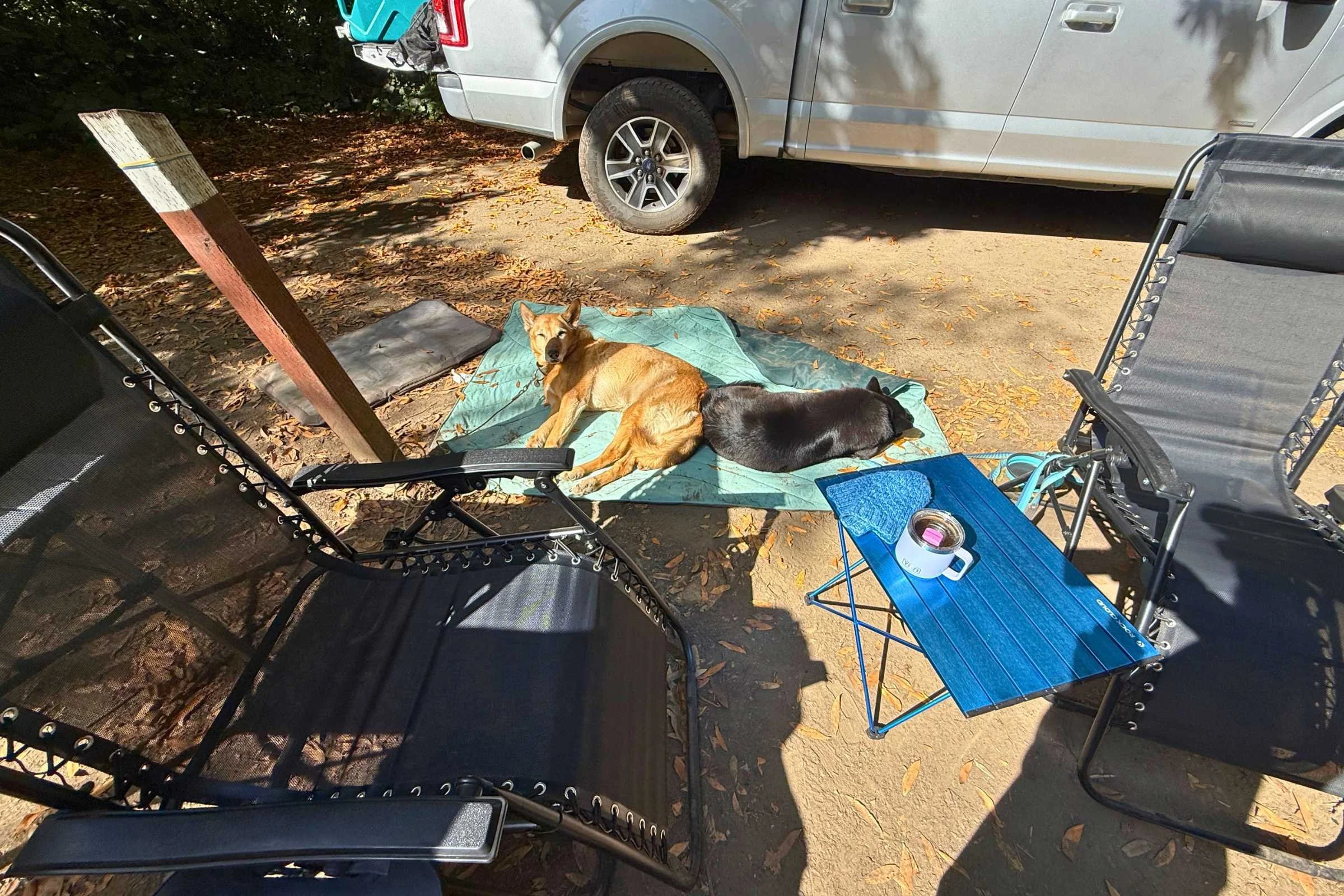   Rock Cloud Portable Camping Table used as a side table between camp chairs  