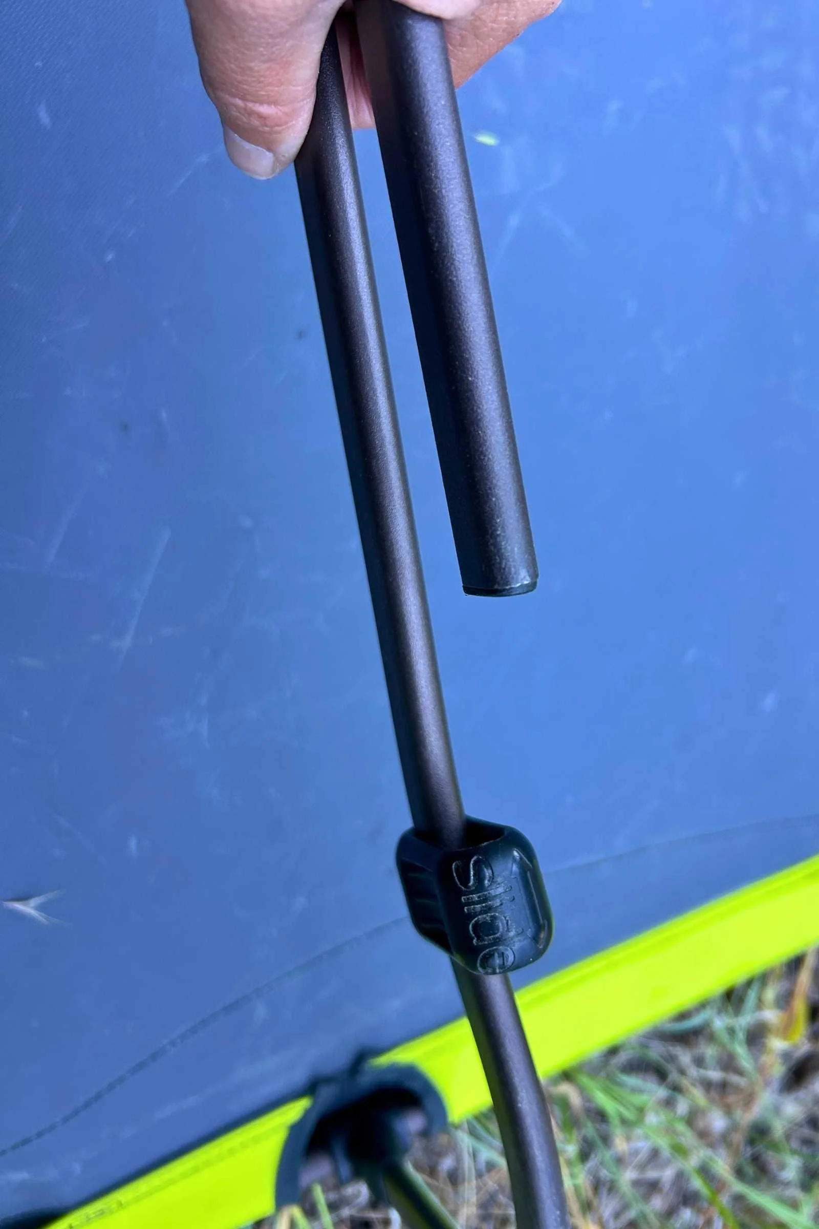  A closeup of a leg of the Zempire W Leg Stretcher V2 camping cot. 