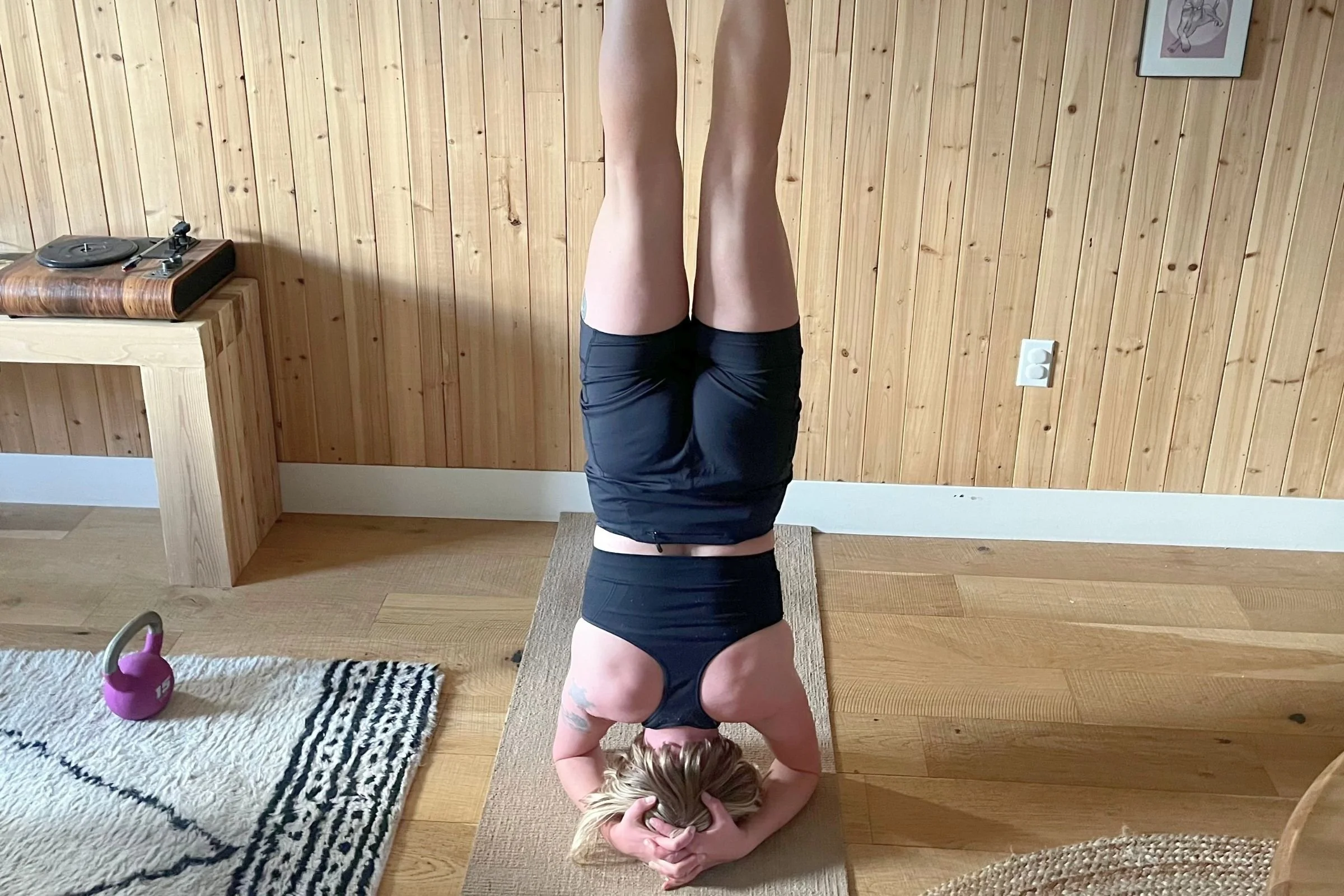   The Ridge Send-It Seamless Racerback Sports Bra during a headstand test.  