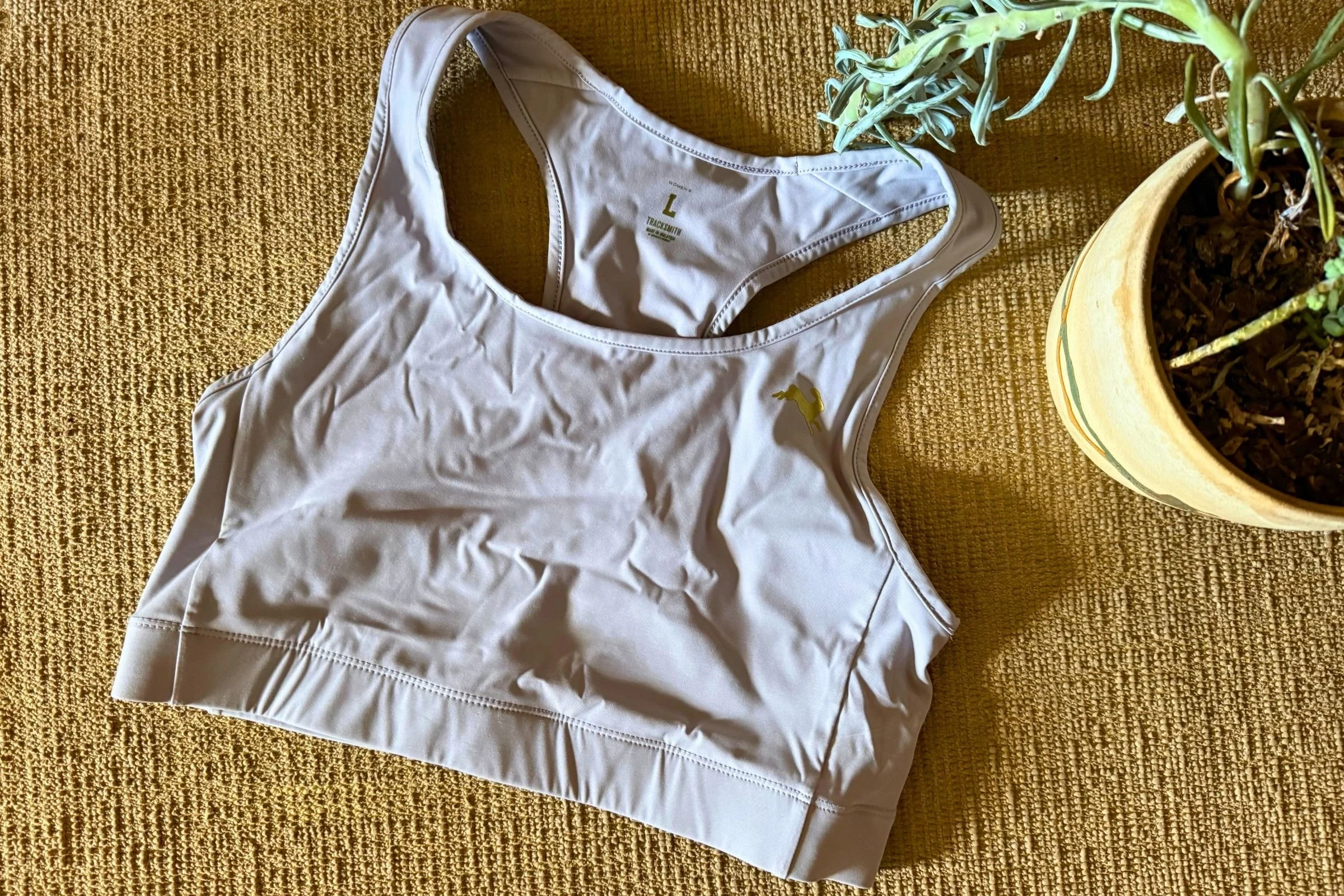   The Tracksmith Allston bra is a lightweight yet supportive synthetic sports bra that’s great for hot weather and high sweat activities.  