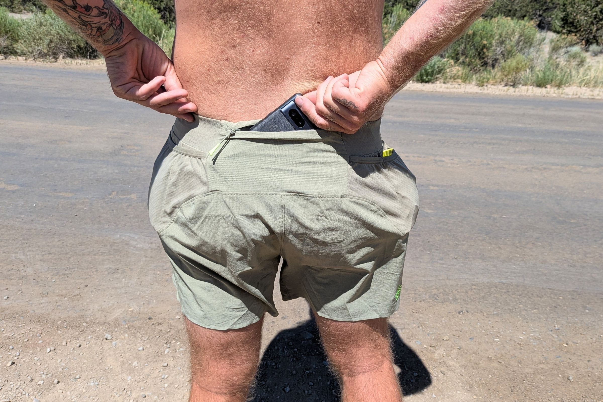  The rabbit FKT shorts have a large zippered phone pocket that’s large enough for a Google Pixel 10 with a silicone case and magnetic tripod  