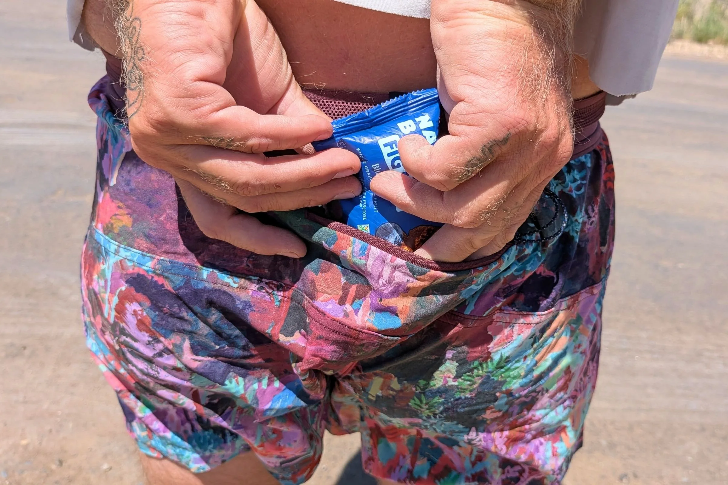   The Janji AFO Middle shorts have small external pockets that can hold a gel or bar.  