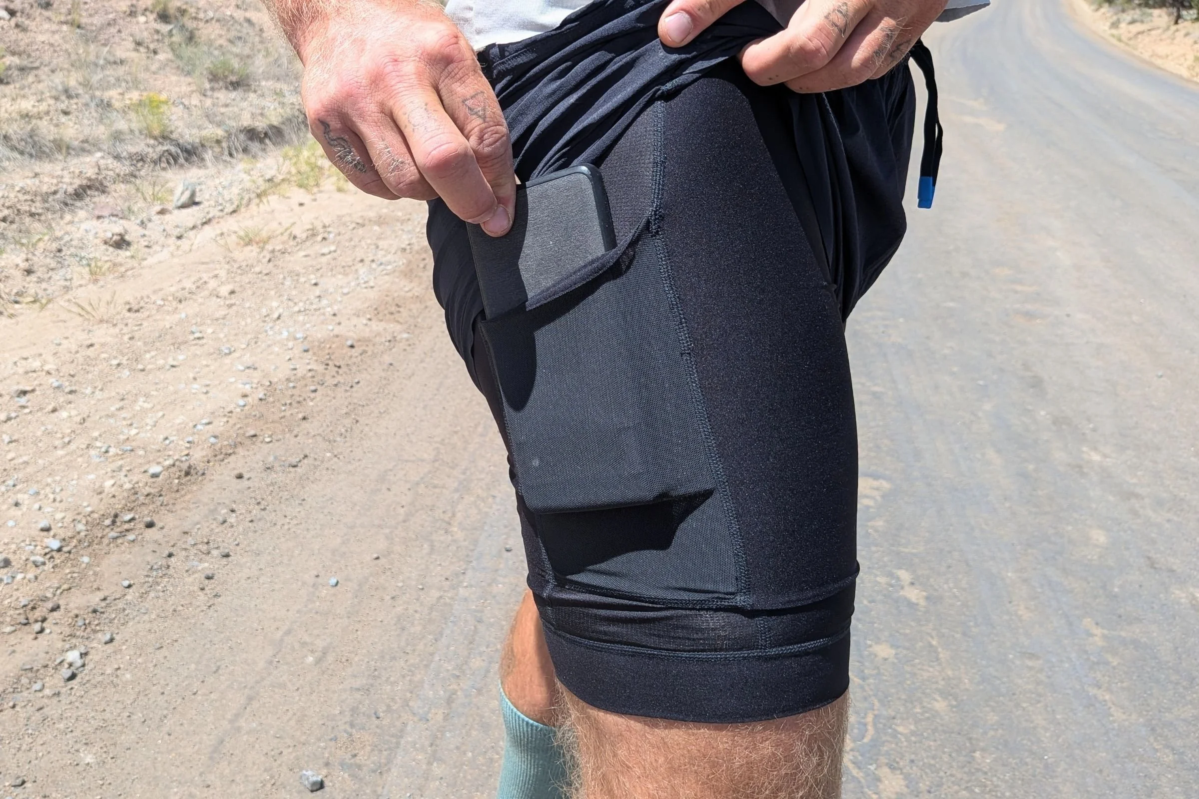   The Janji 2 in 1 shorts have a phone pocket on each leg of the inner compression liner  