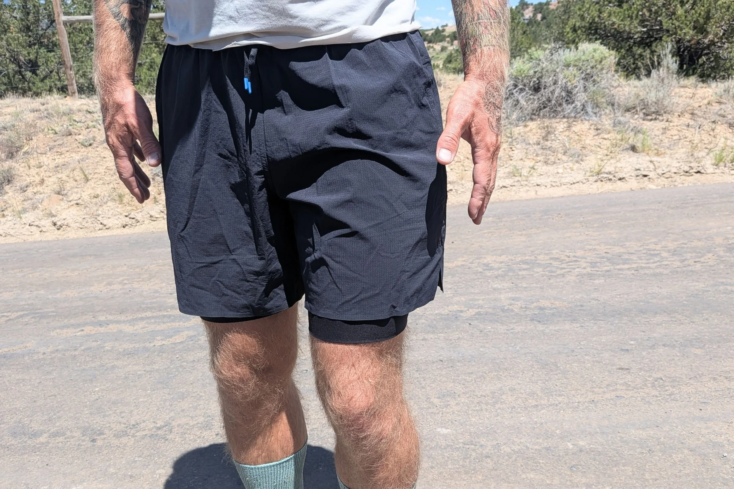   A closeup of the Janji 2 in 1 shorts, showing the compression liner that is longer than the outer shorts  
