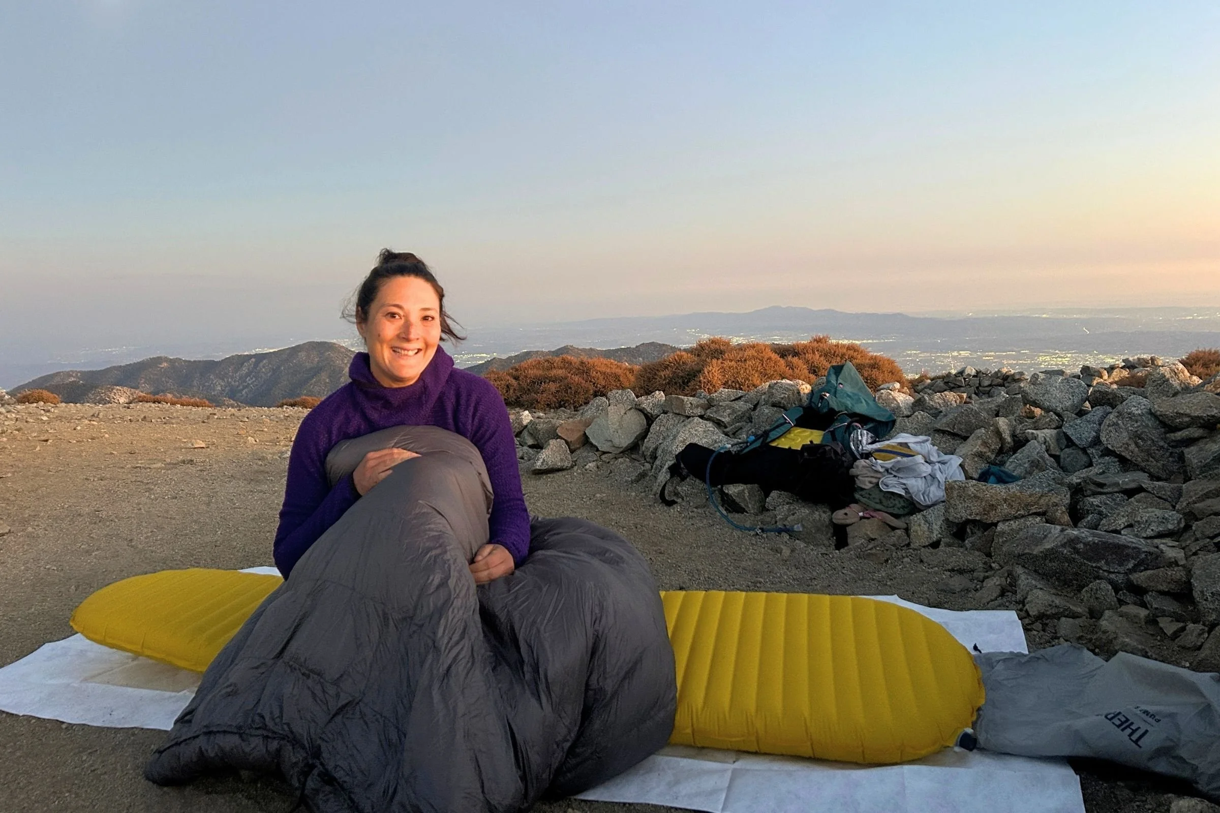   A tester uses the Outdoor Vitals StormLoft Down TopQuilt on a backpacking trip, paired with a sleeping pad for a lightweight sleep system.  