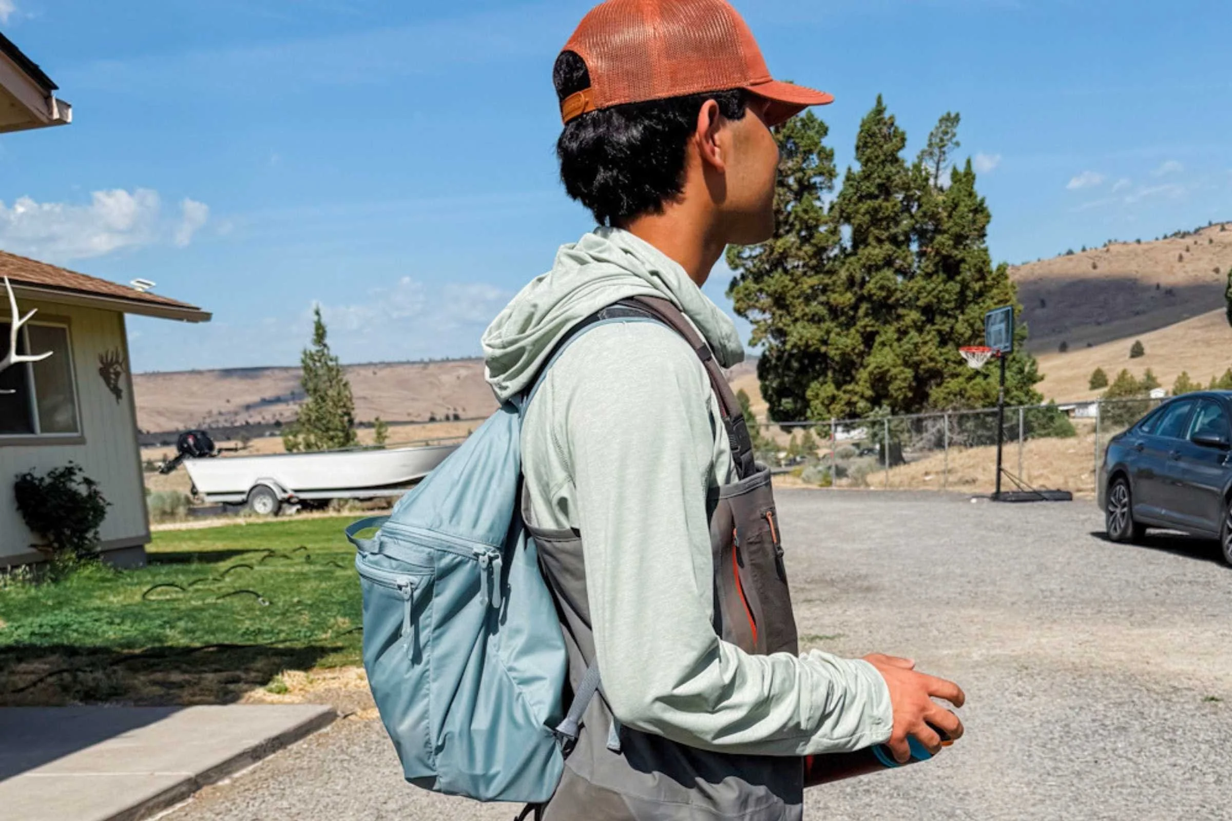   A tester carries the lightweight Arc’teryx Heliad 15 on a casual outing, with the compact pack sitting comfortably against their back.  