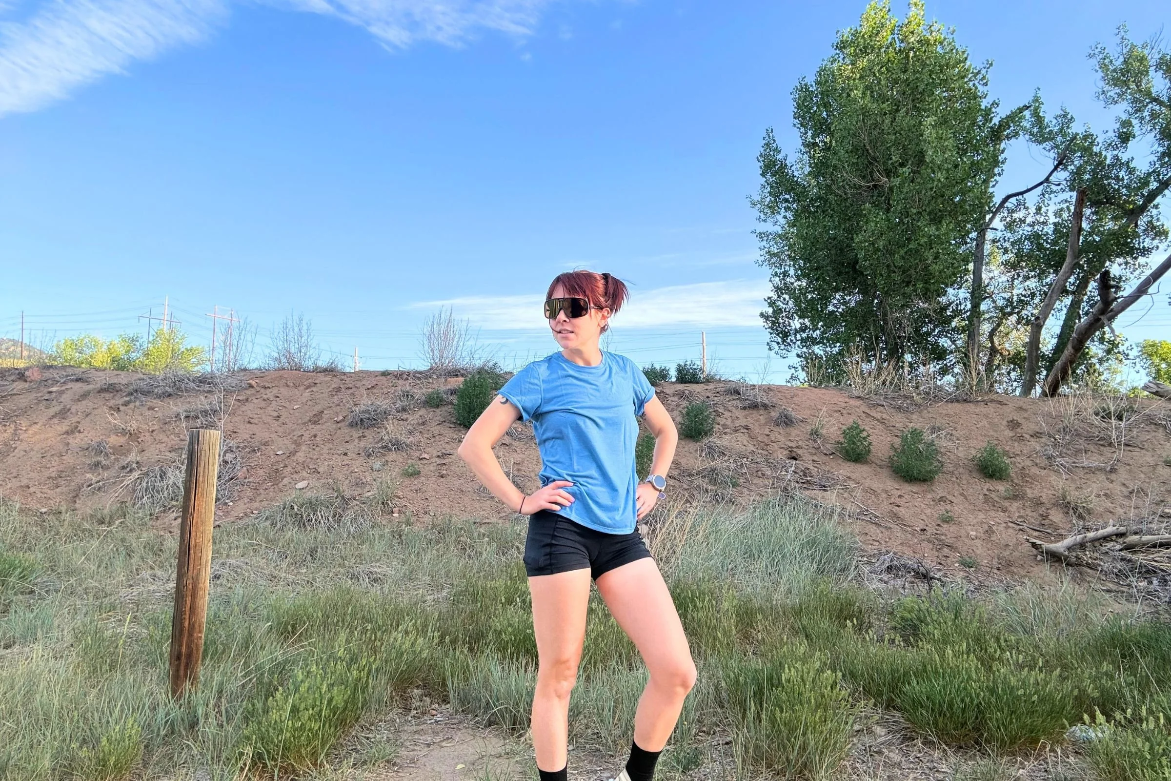   A runner wearing the Patagonia Capilene Cool Trail shirt while taking a break outdoors.  
