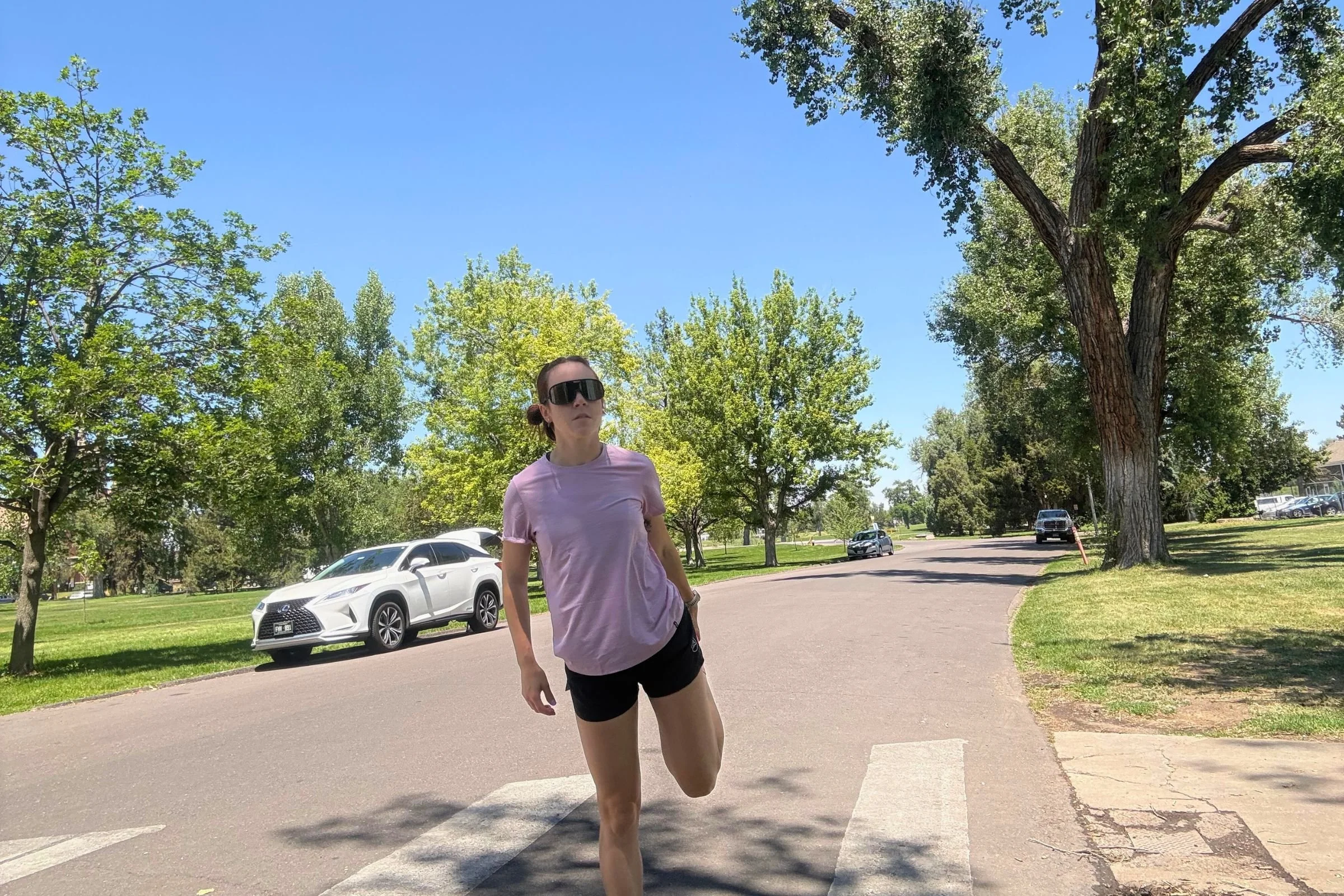   A runner wearing the Patagonia Capilene Cool Ultra shirt on a sunny neighborhood run.  