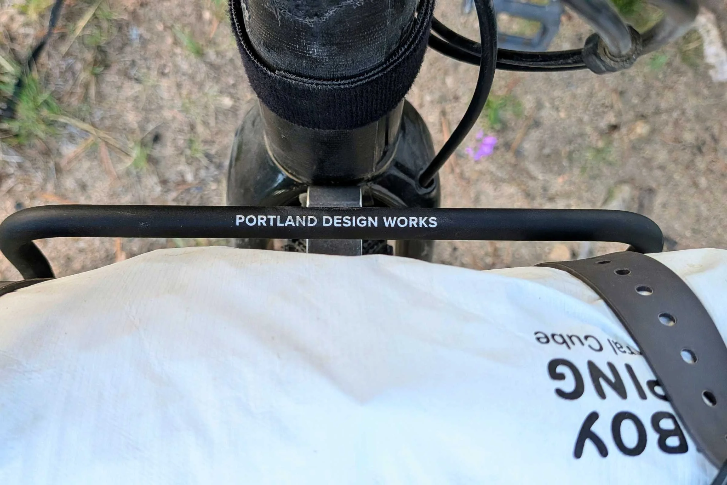   A close-up of the Portland Design Works OxRack Front Rack shows its wide aluminum platform mounted above the front wheel.  