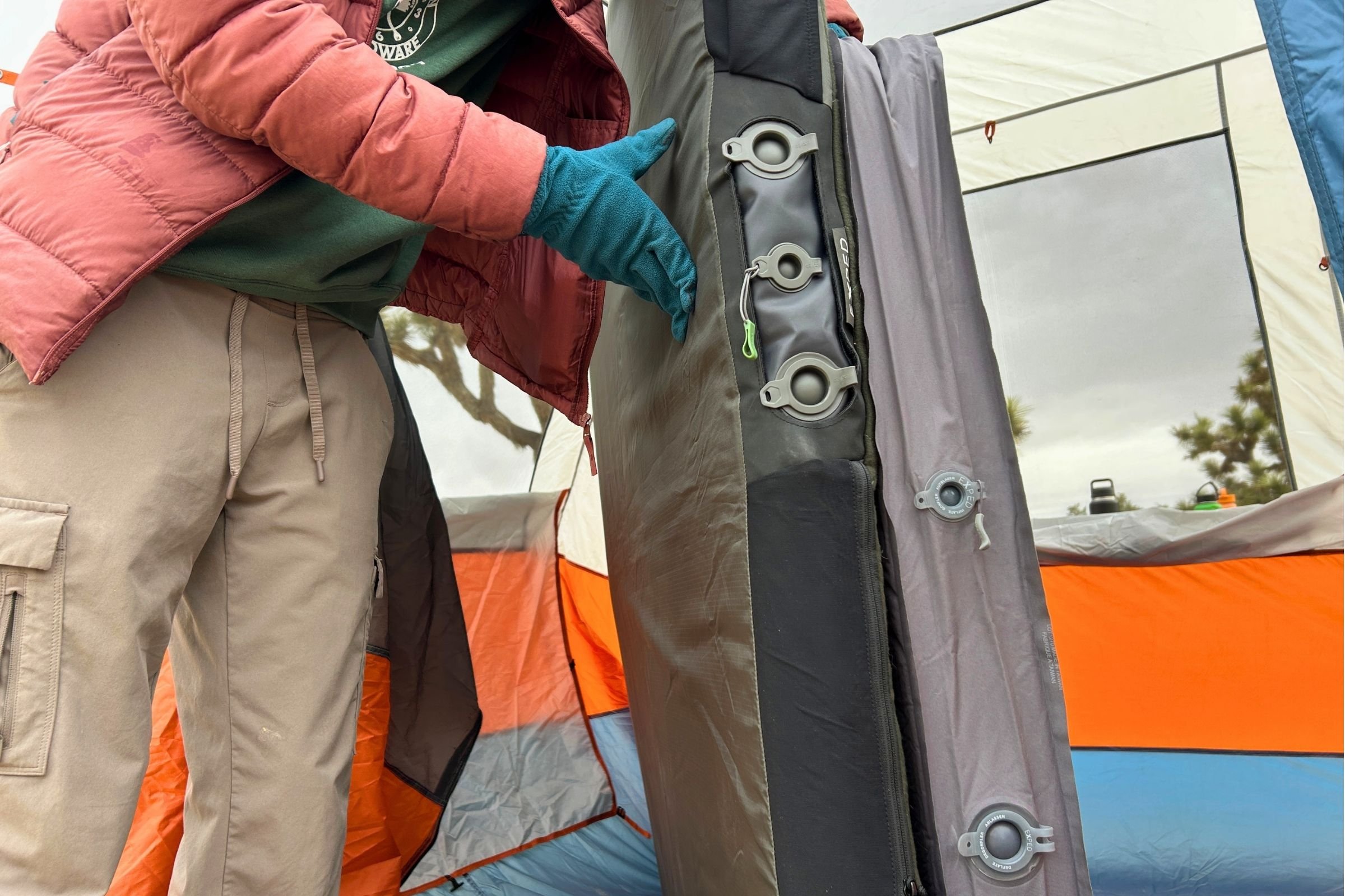   A close-up of the EXPED MegaMat Duo shows its inflation and deflation valves along the side of the mattress.  