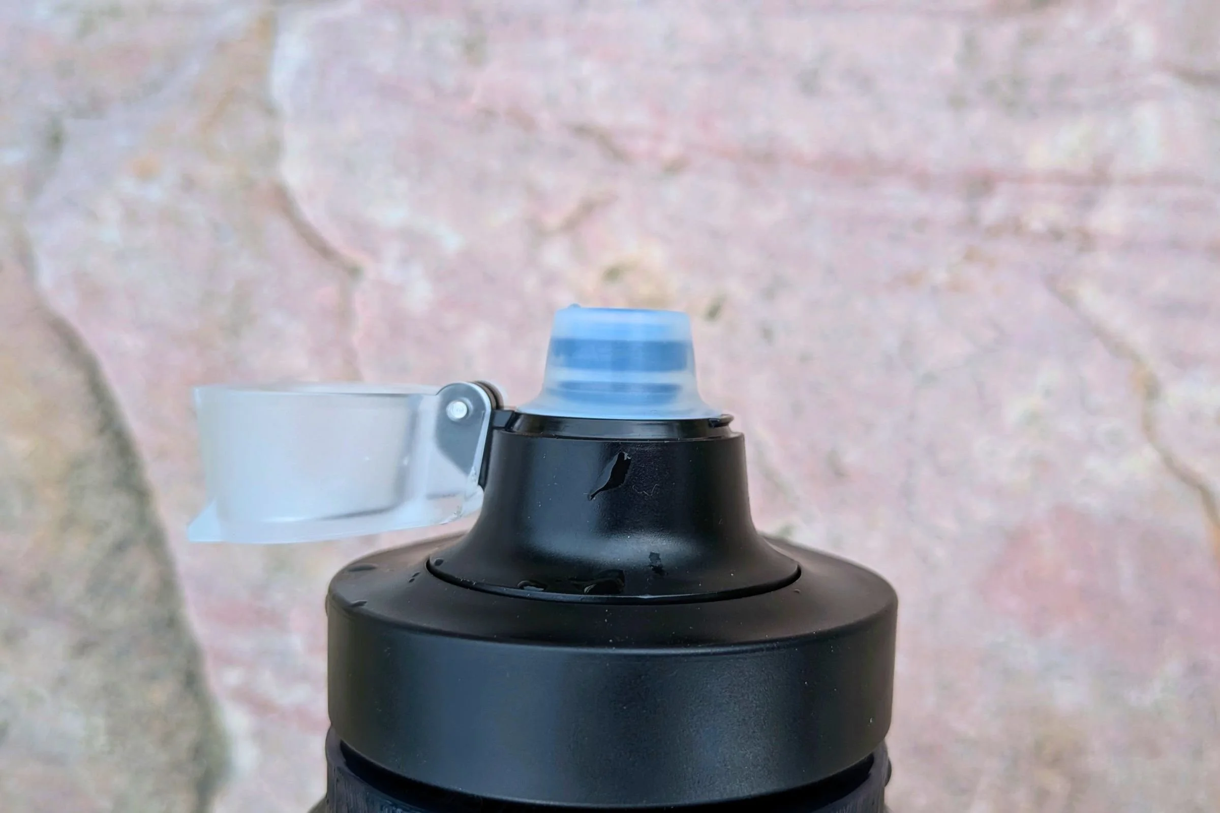   A close-up of the Katadyn BeFree AC Bottle’s sport cap shows the covered mouthpiece that helps keep dirt and road grime away from the drinking spout.  