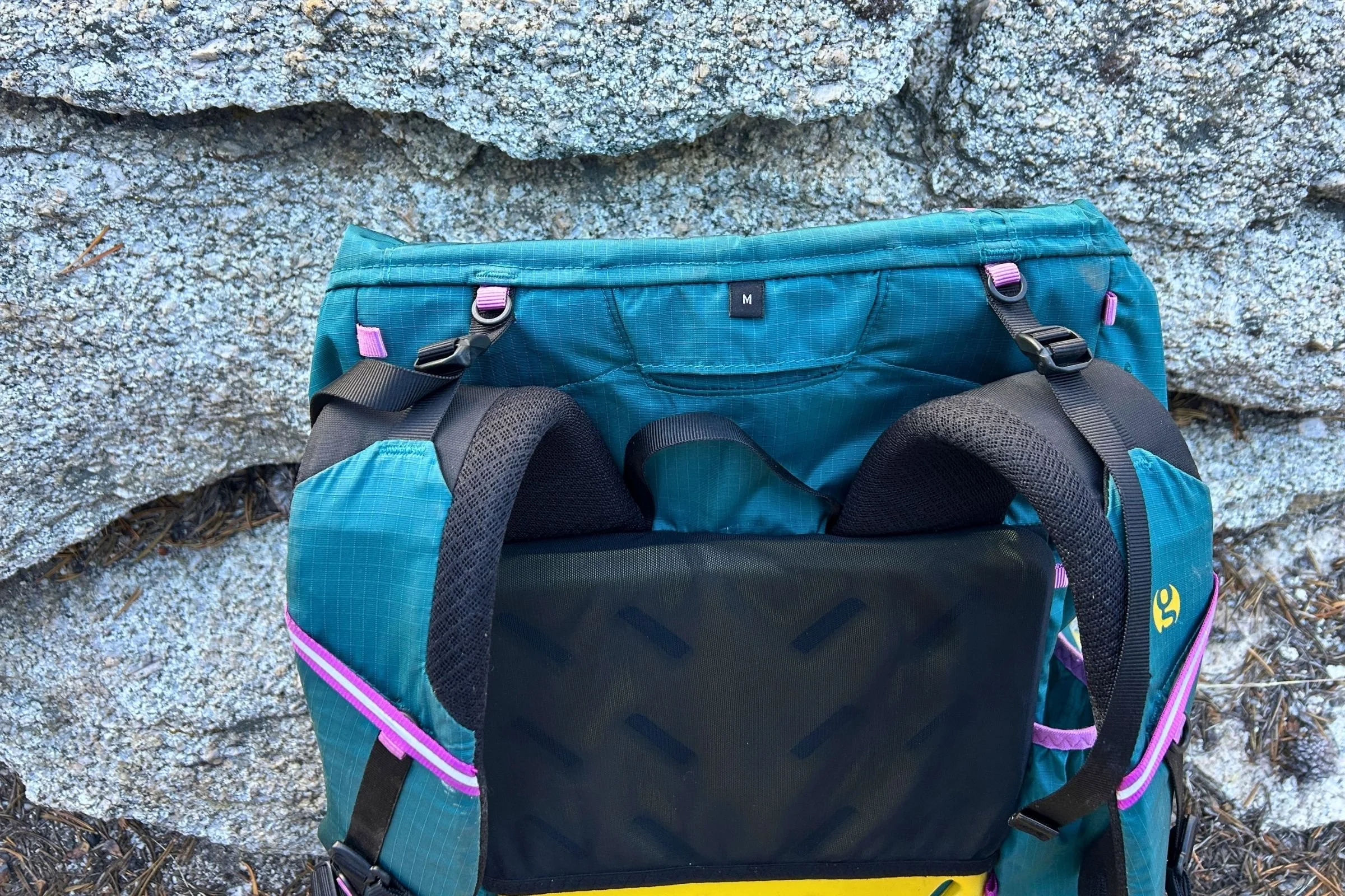   A close-up of the Gossamer Gear Mariposa 60 shows its padded S-curve shoulder harness and integrated hip belt pockets for carrying small essentials within easy reach.  