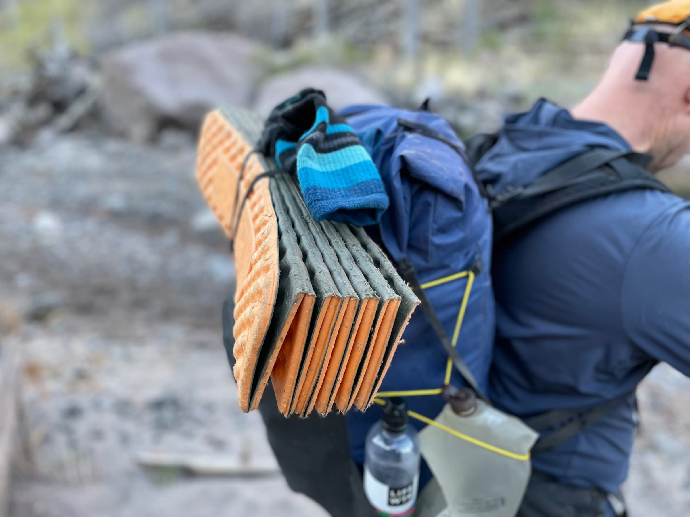   The author on the Northern New Mexico Loop with the Swift X. Side compression cords help manage the volume of the pack. You can secure items to the outside of your pack, such as for drying clothes, as seen here. We recommend doing so with diaper pi