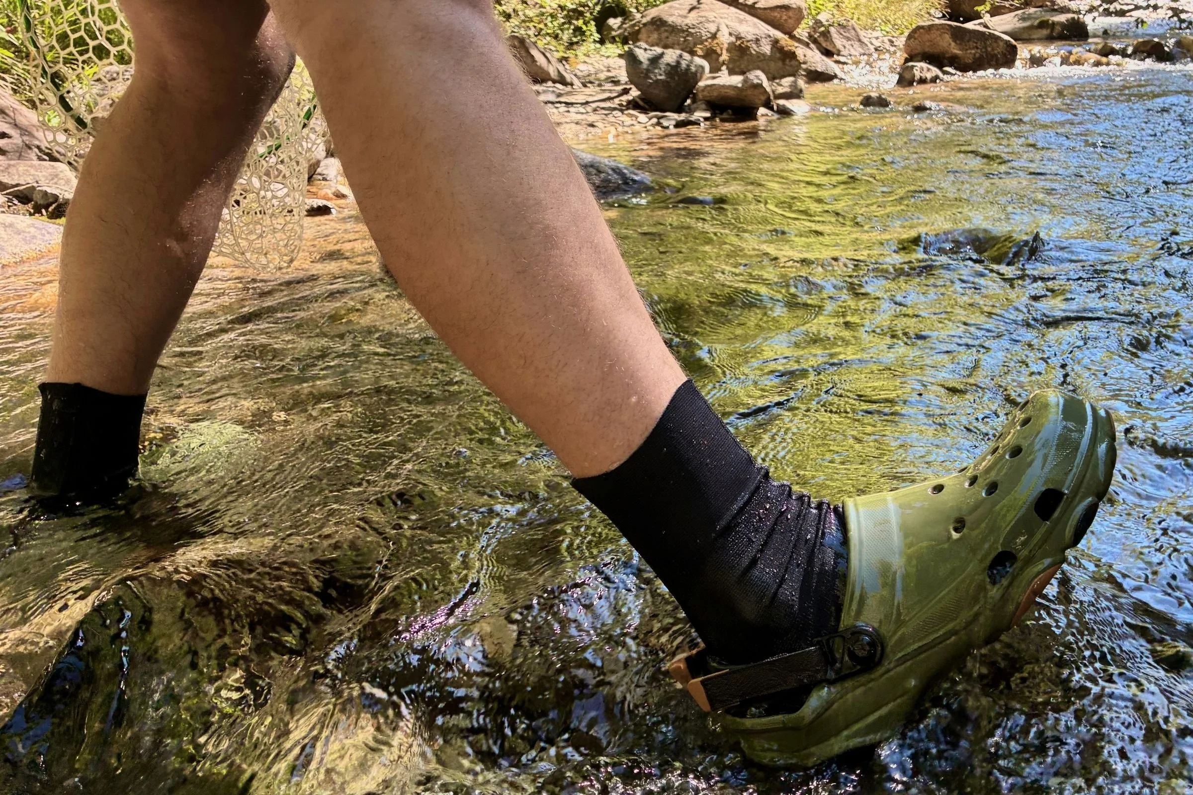   The Crocs Classic All-Terrain Clogs drain water and fine gravel easily while wet wading, though small rocks can enter through the side ventilation ports.  