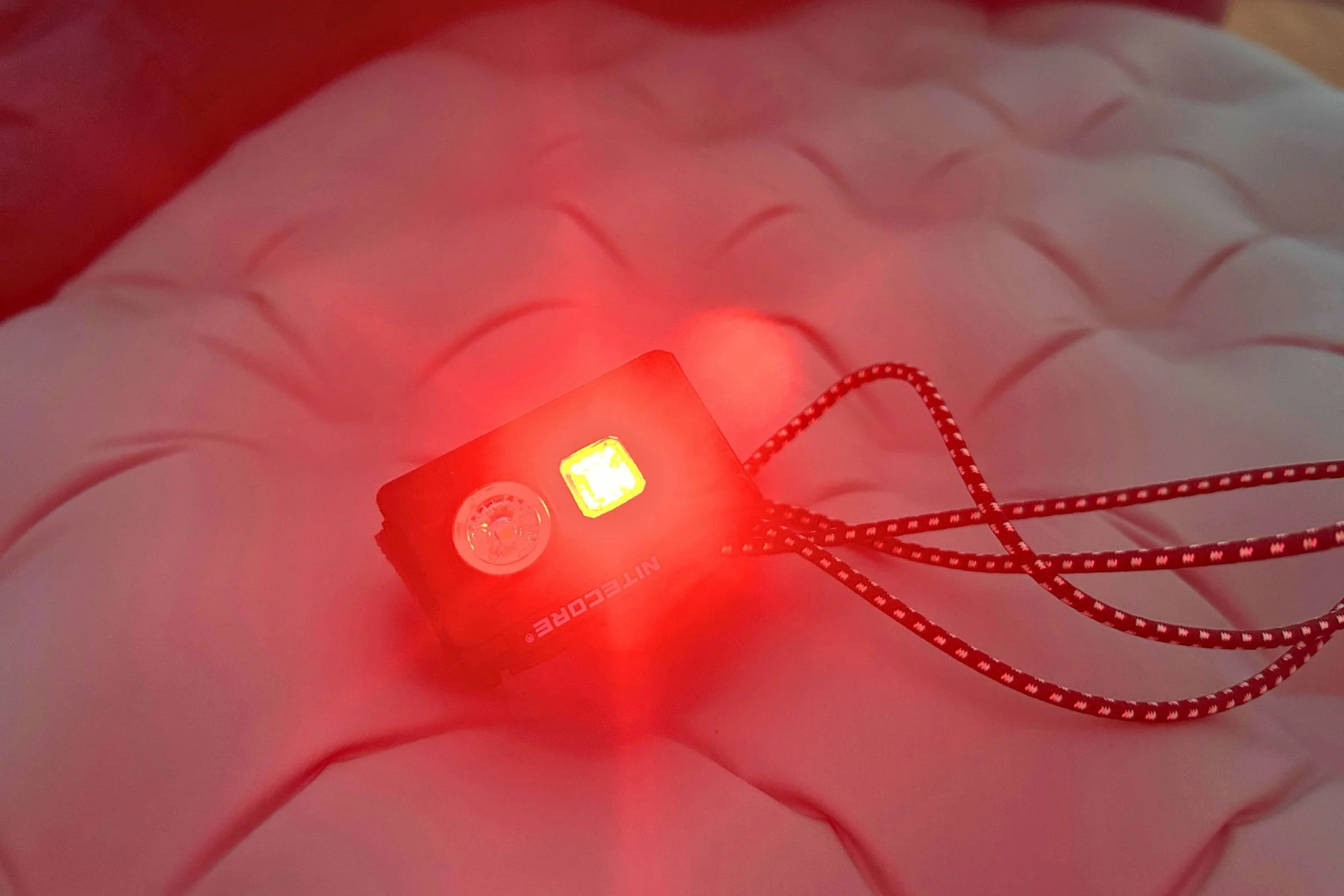   The red-light mode on the Nitecore NU20 Classic provides low-light illumination for nighttime tasks around camp.  