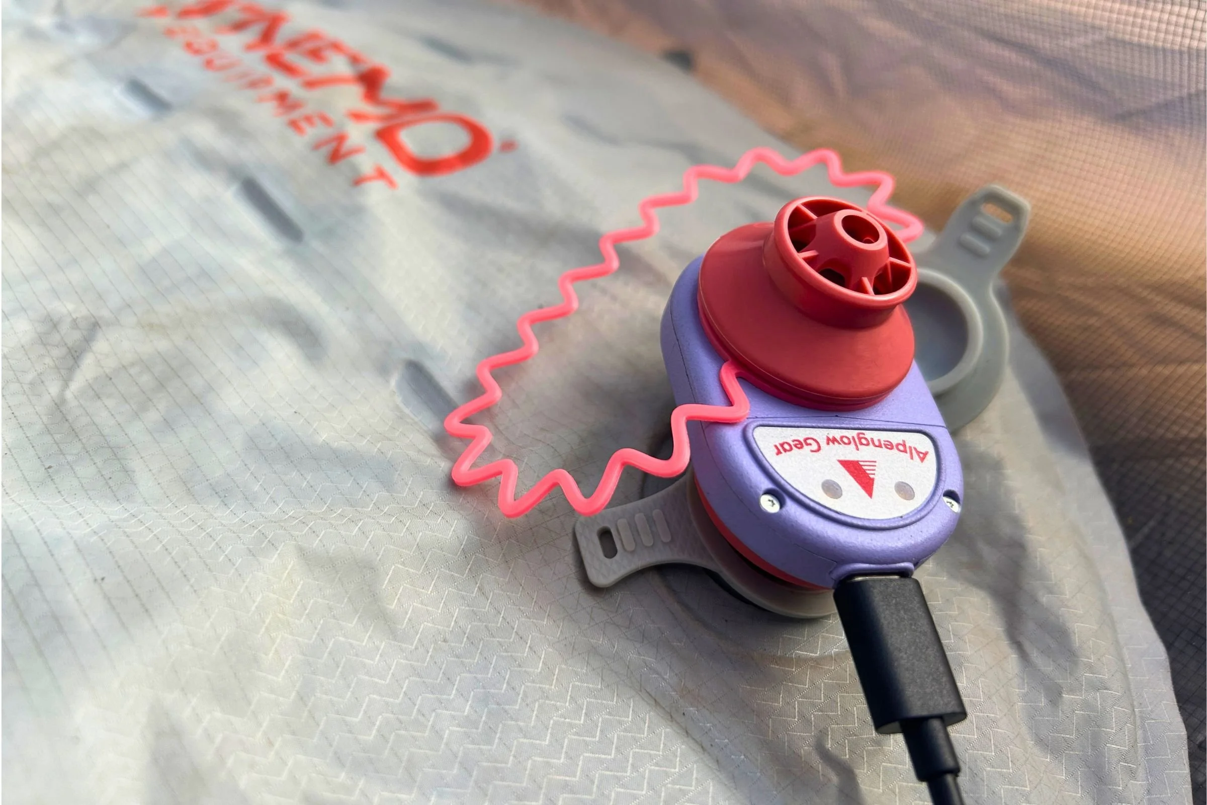   The Alpenblow Lux connects to a sleeping pad to handle inflation without having to sit and blow up the pad by mouth.  