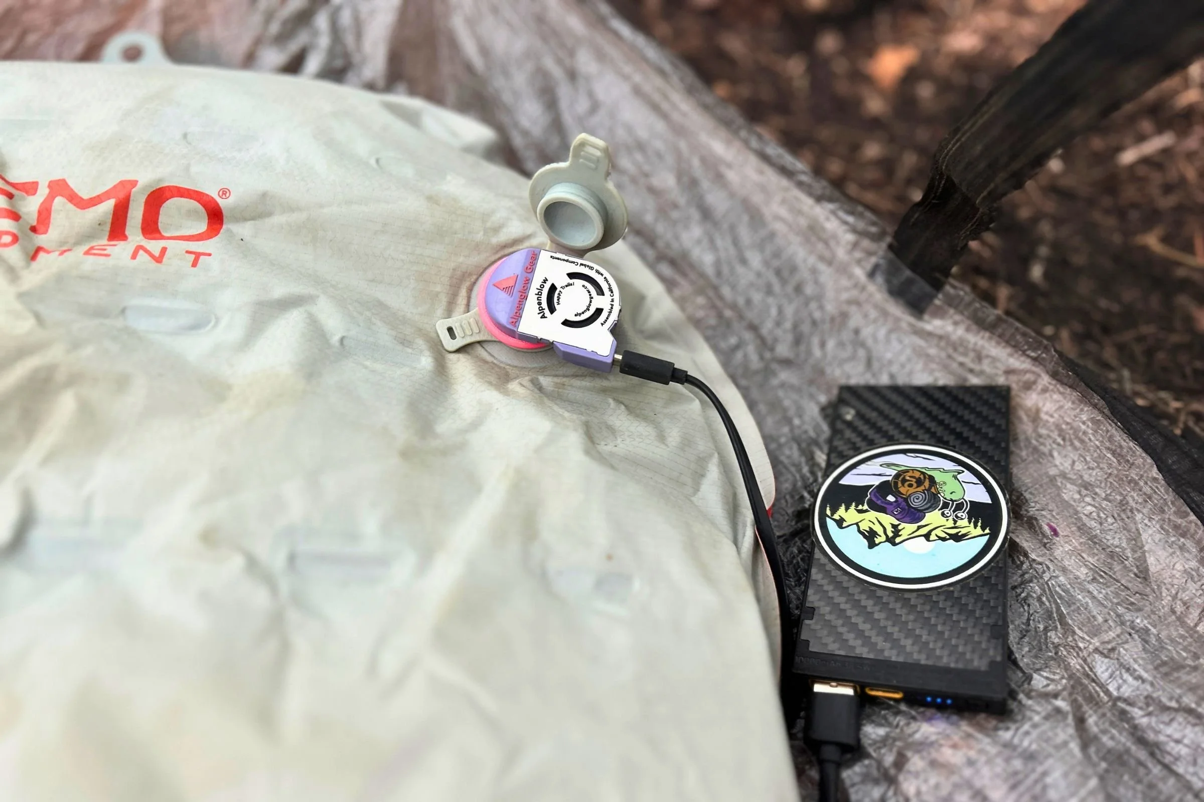  The Alpenglow Gear Alpenblow Classic runs from a USB-C power bank to inflate a sleeping pad, keeping the pump itself to an ultralight 0.3 ounces.  