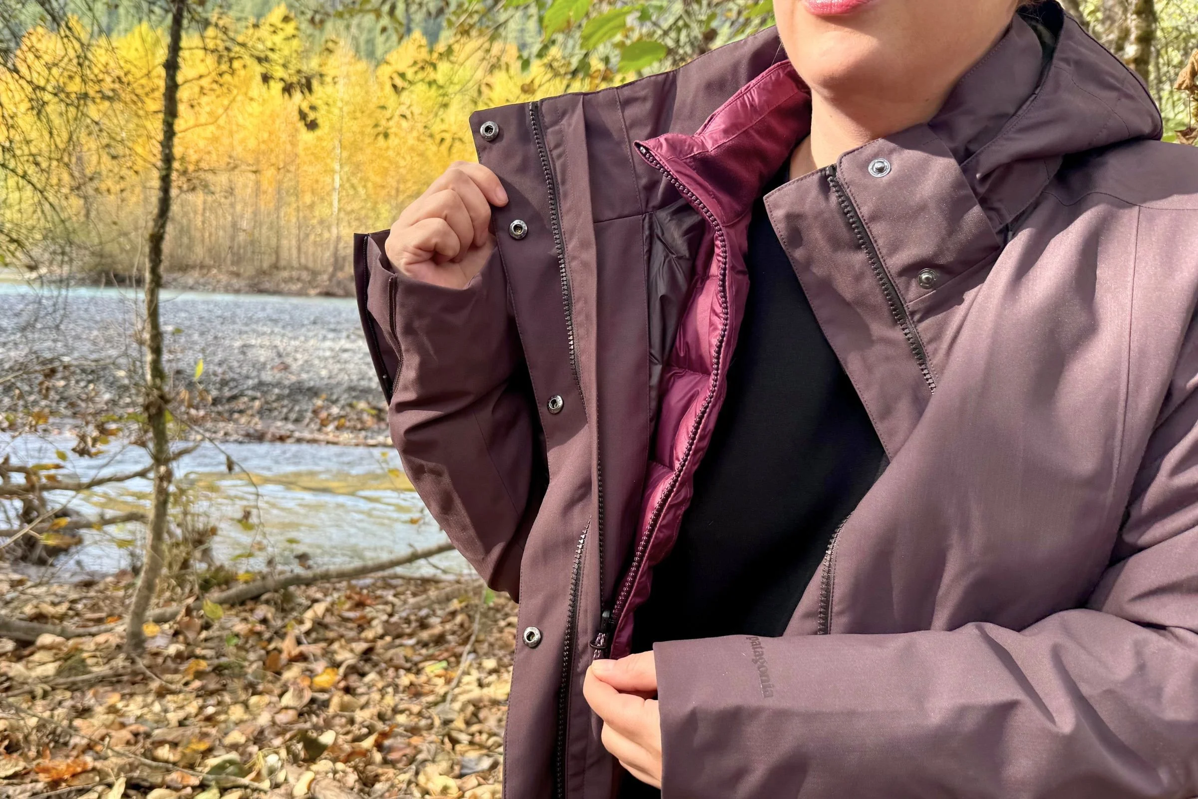 Zipping the inner down jacket away from the outer waterproof shell.