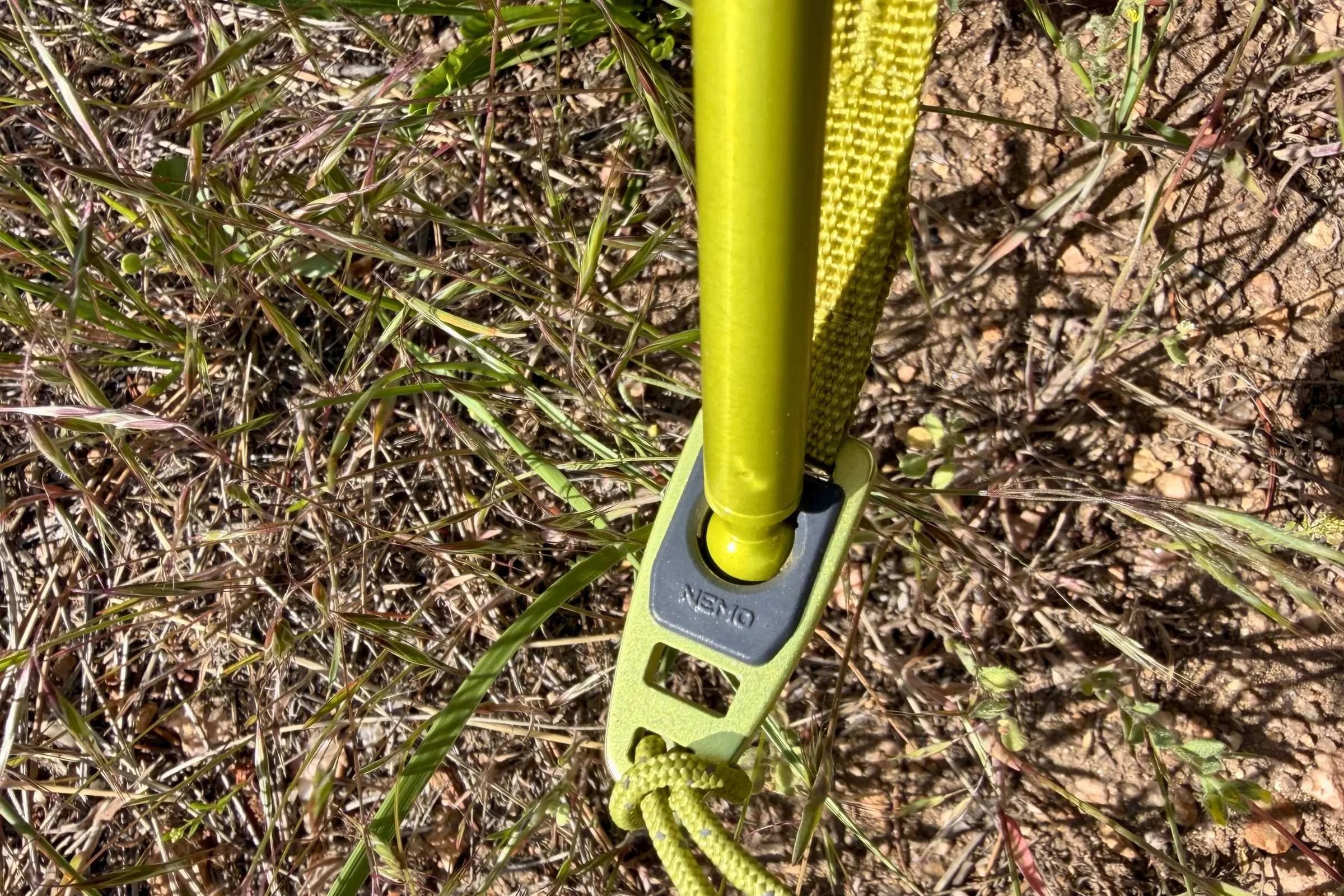 The ball and socket attachment point also has a small slit where the metal rain fly clip attaches, facing out.