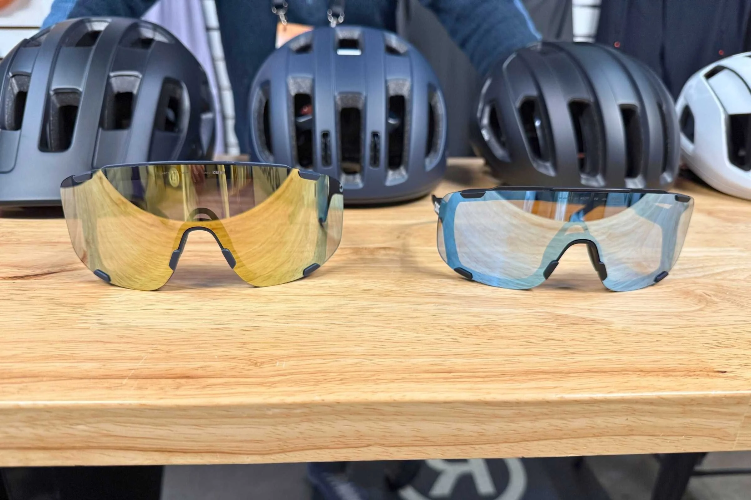 POC Devour small-fit performance sunglasses displayed with cycling helmets at Outdoor Market Alliance Winter 2026