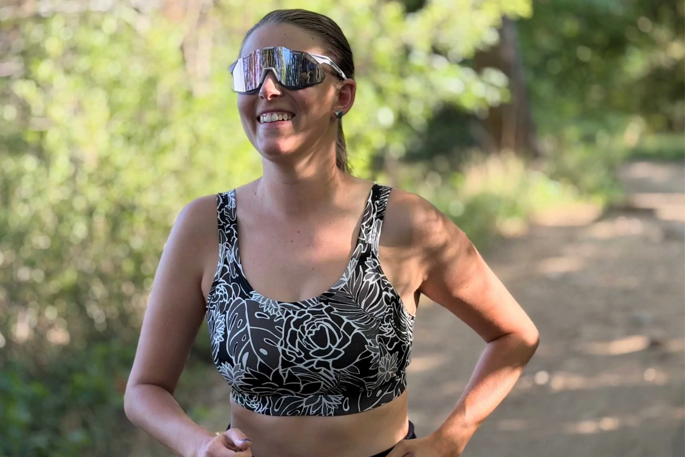 Woman running in the Title Nine Tech Athena 2.0 sports bra