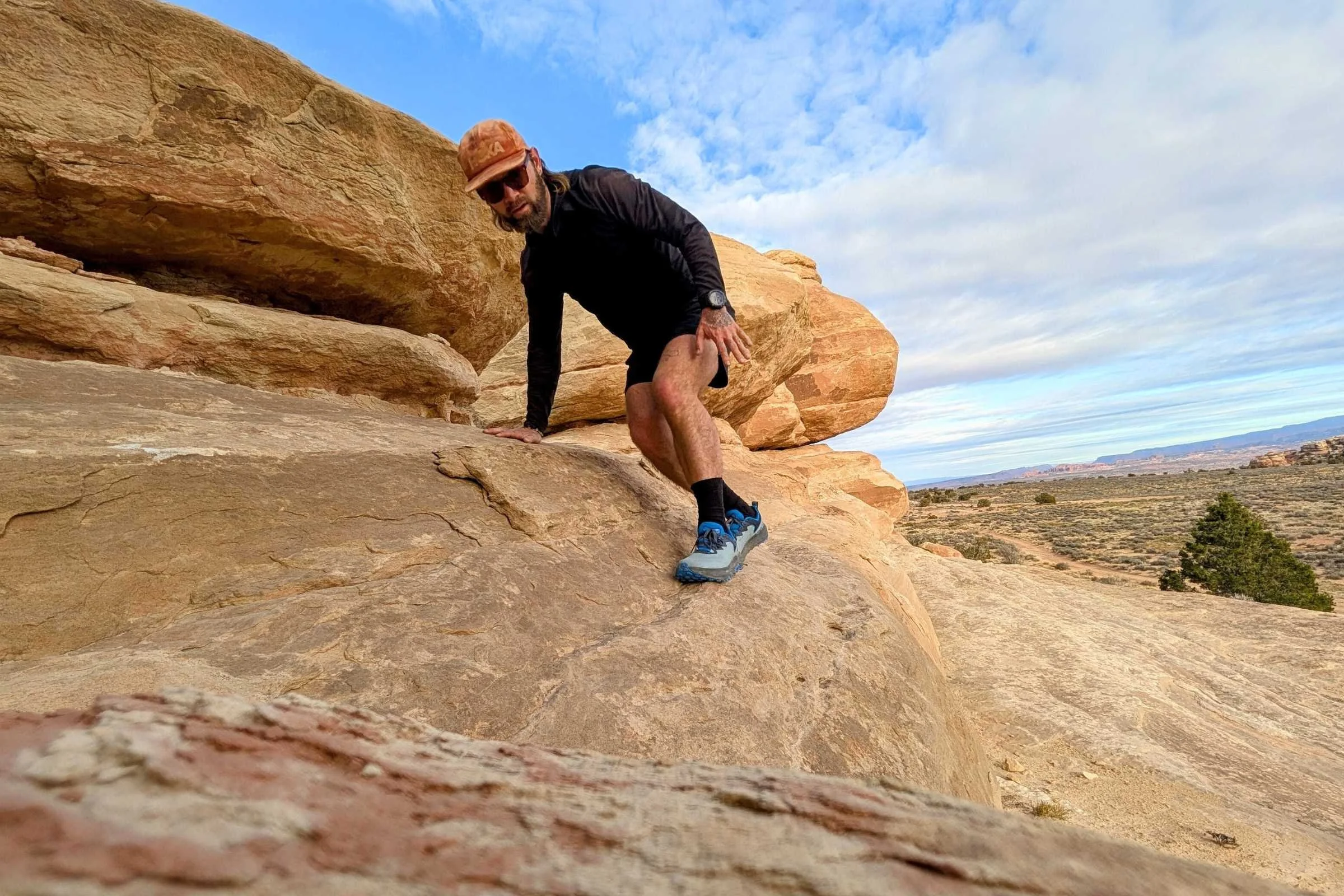 Wearing the Altra Timp 6s while scrambling on steep slick rock in Utah.