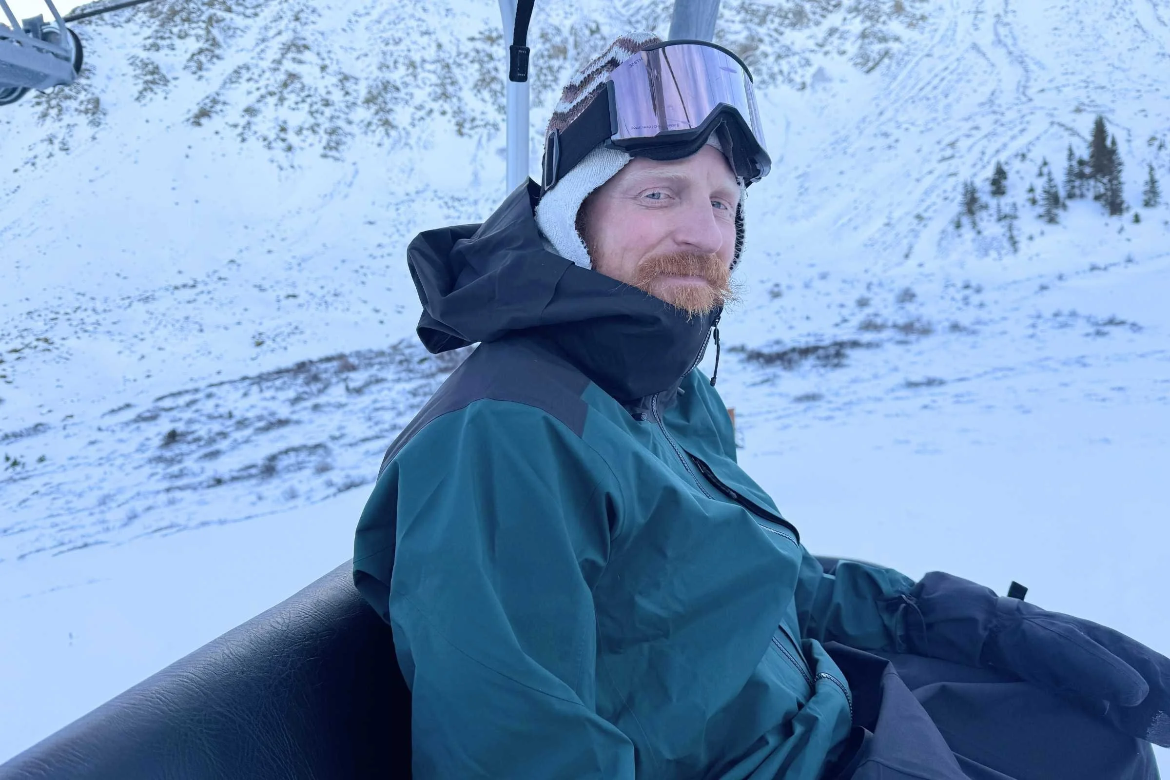 The PowSlayer has excellent weather protection. Here, it keeps our men’s tester happy by blocking cold wind on the chairlift. Photo by Stasia Stockwell.