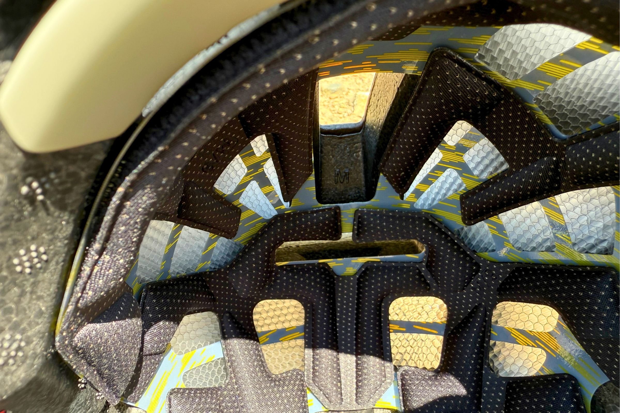 Close-up of the inside of Smith Mainline Mips Helmet, showing its yellow-and-black lining.