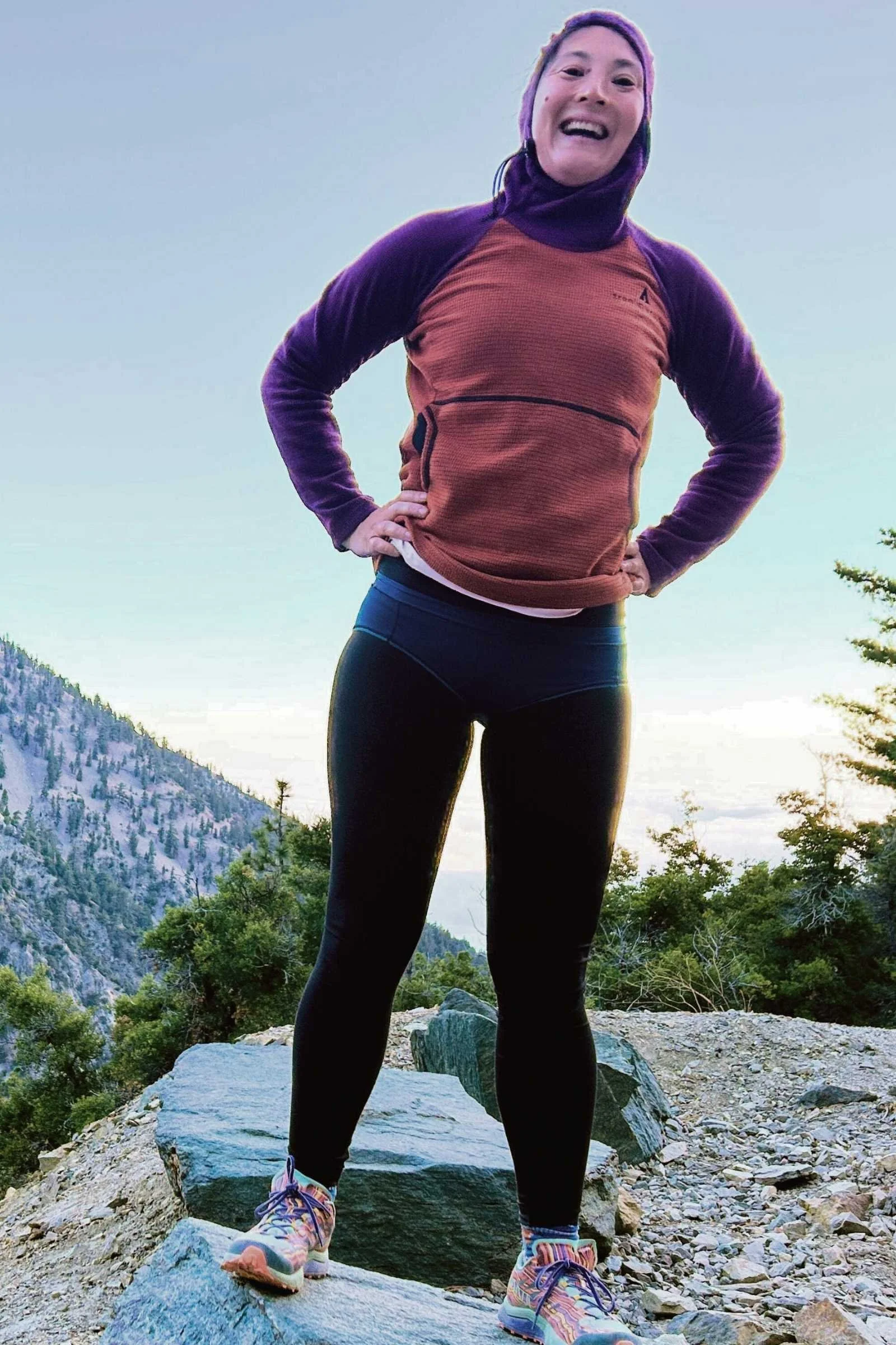 Hiker modeling the Paradis Sport Natural Fiber Bikini over the top of black leggings
