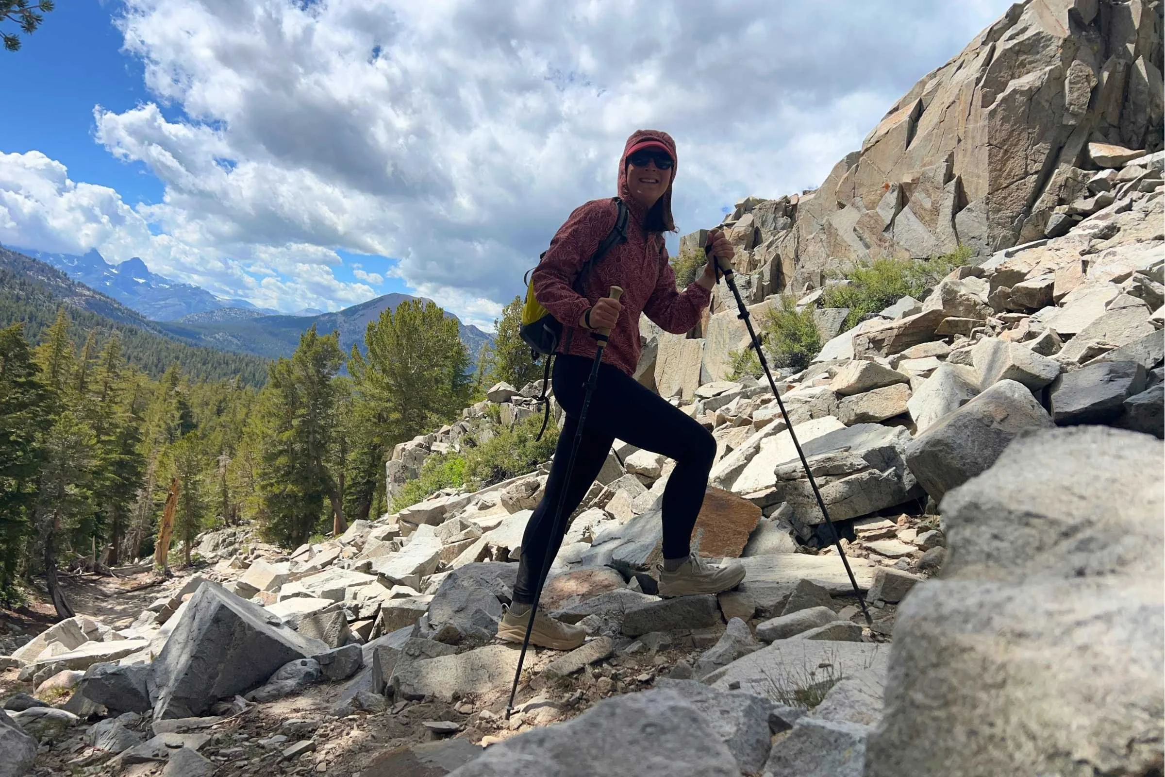 The author hiking on a rocky trail while using the Gossamer Gear FT3 trekking poles for balance.