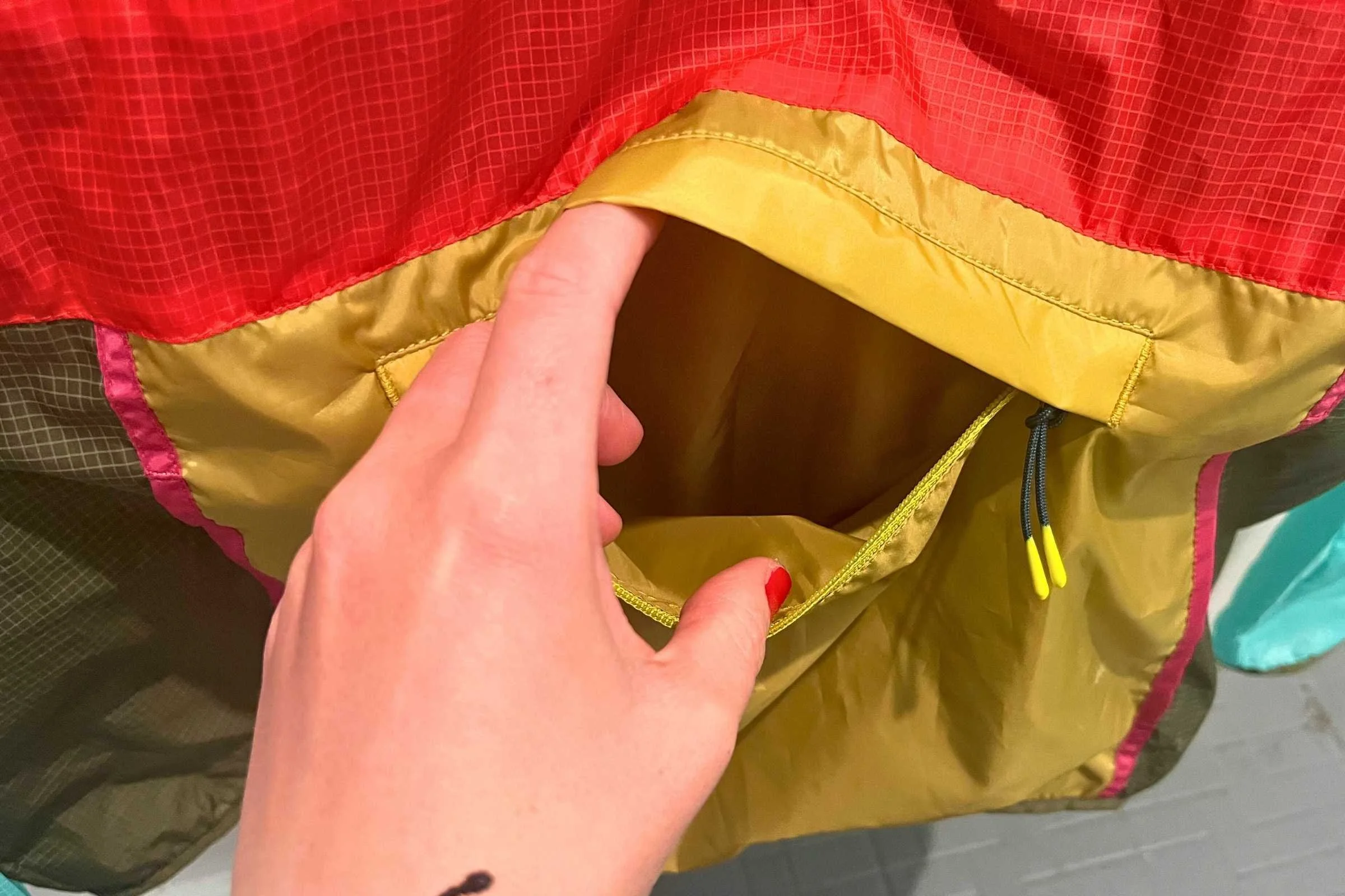 The Cotopaxi Teca’s zipped kangaroo pocket has room for extra layers, snacks, a phone, keys, wallet, and more.