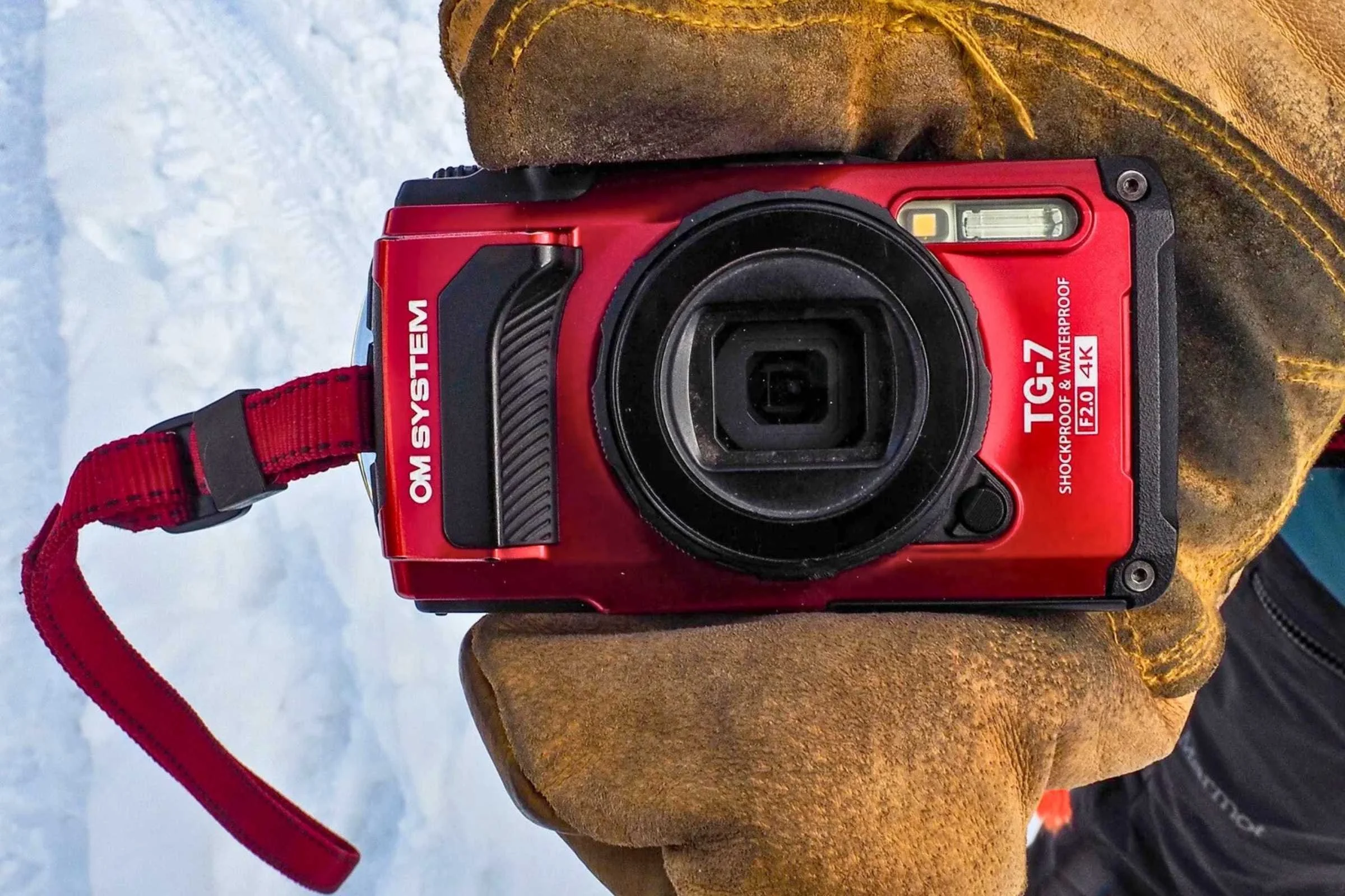 The OM System TG-7 has improved the grirp, shown on the camer's left side, to enhance the ability to hold it even with mittens or gloves.